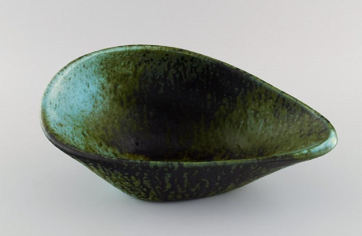 Accolay, France. Freeform bowl in glazed ceramics. 
Beautiful glaze in green and dark shades. 1960s.
Measures: 30 x 14.5 cm.
In excellent condition.
Stamped.