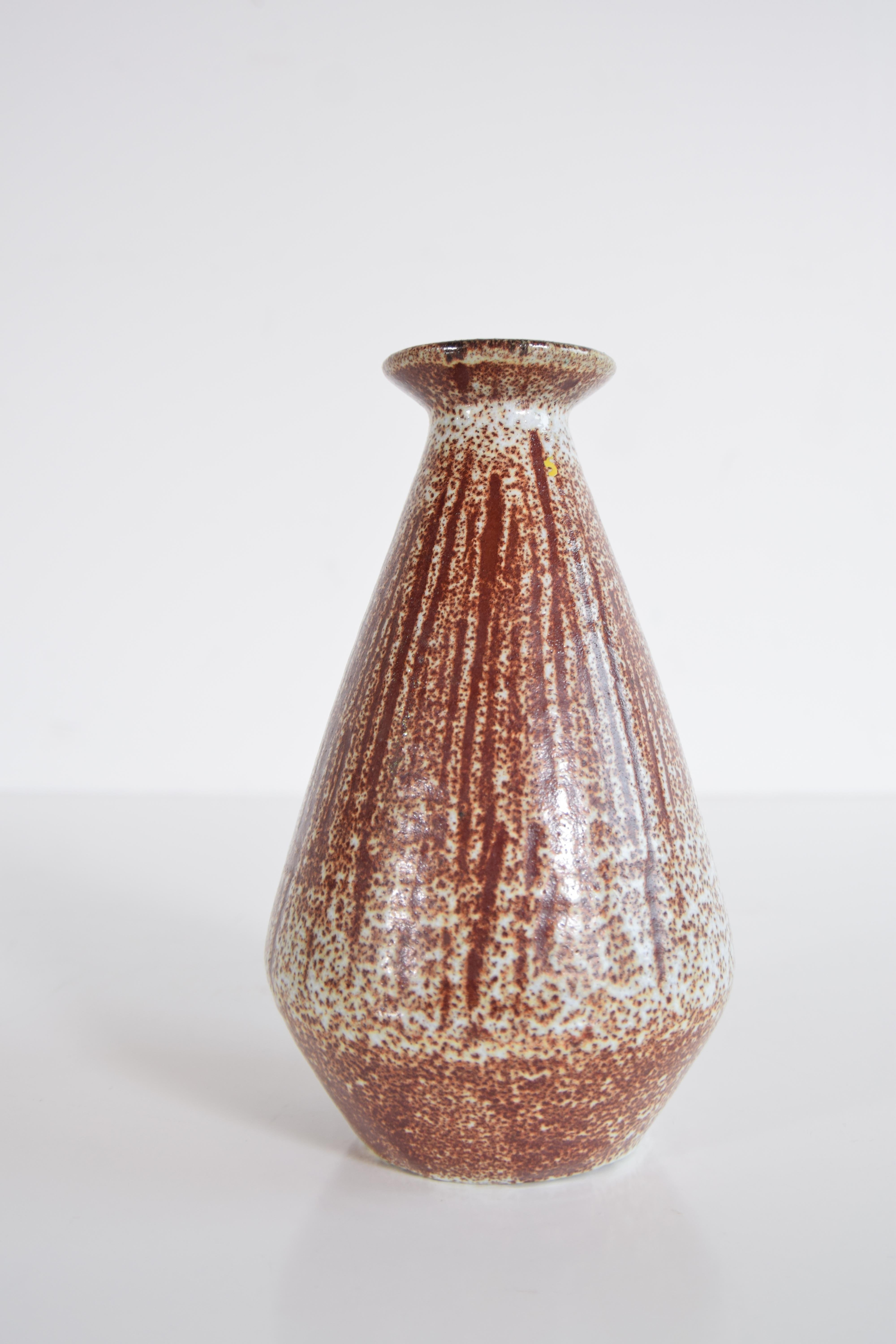 Pottery vase from France, circa 1955. Produced by Accolay. The vase's colors are Earth-tones, with a beautiful glaze. Fully signed on the bottom 