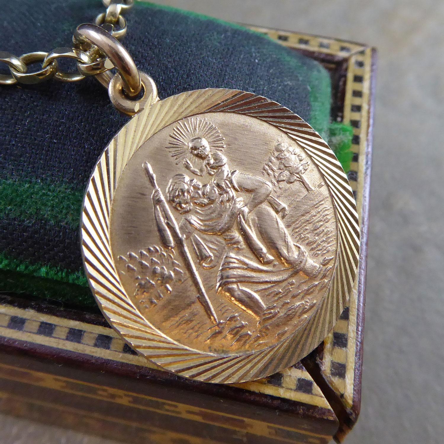 The enduring symbol of St. Christopher, patron saint of travellers.  This St. Christopher medallian has been crafted from 9ct yellow gold in 1977.  As expected, it depicts the well-known figure carrying the Christ Child across a river.  The