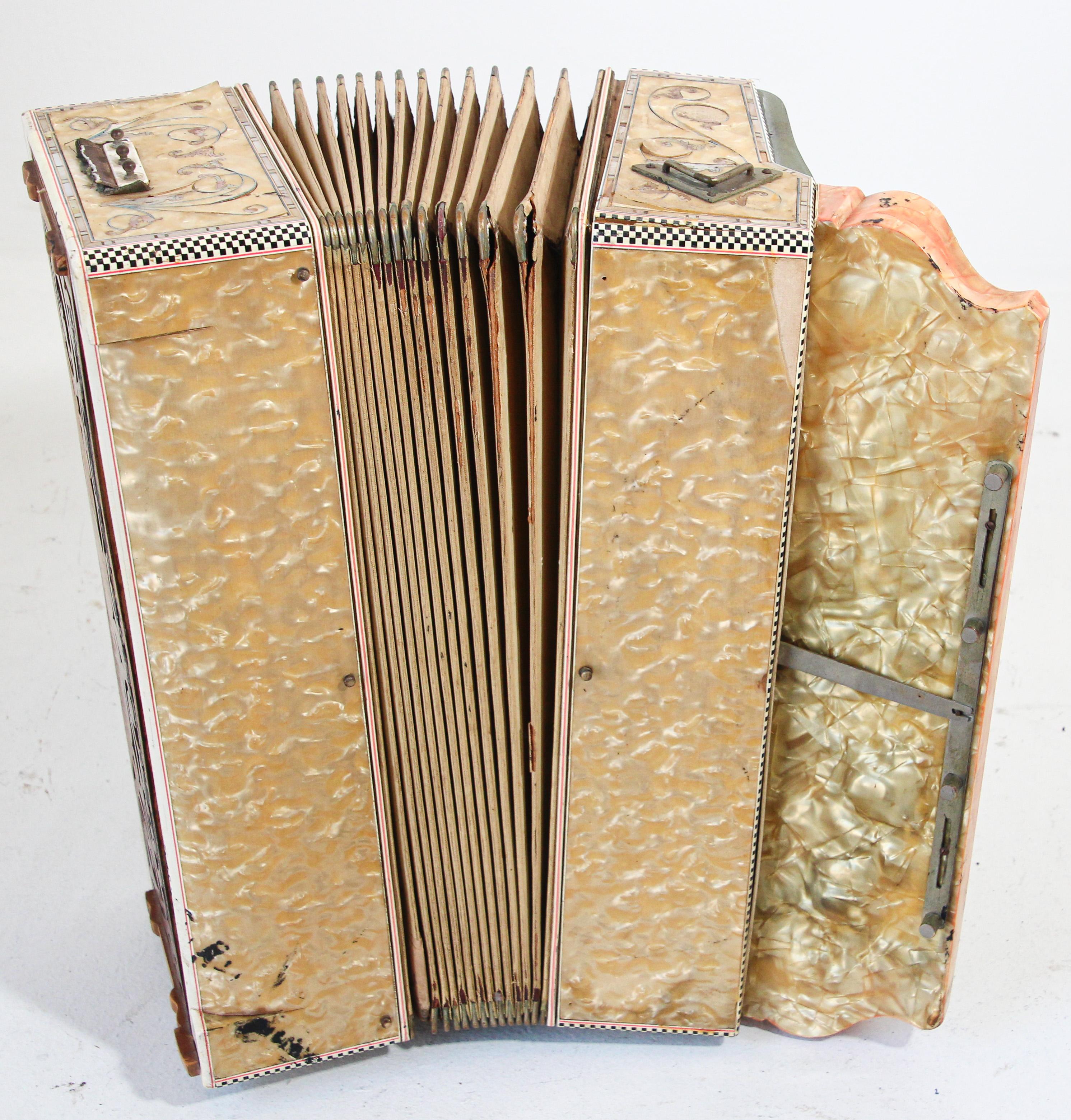Antique Italian custom made accordion by Sabatino Nocentini Castiglion & Figli.
Antique pearl white accordion, Italian accordion with profuse inlay decoration, gorgeous hand made with customer name, manufacturer name.
A beautiful Art Deco style