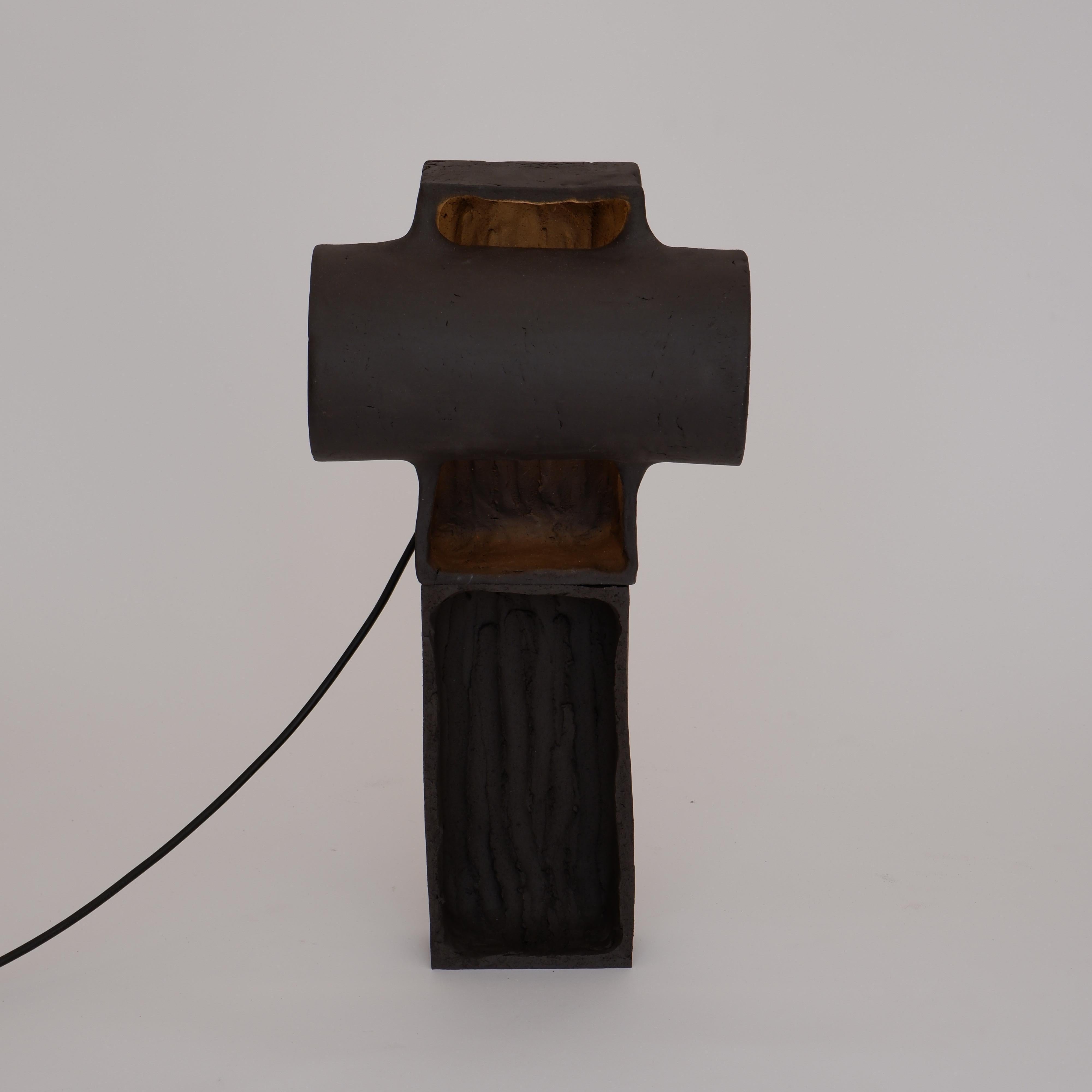 Accre Tall Black Lamp by Ia Kutateladze
One Of A Kind.
Dimensions: D 20 x W 23 x H 44 cm.
Materials: Clay.

Each piece is one of a kind, due to its free hand-building process. Different color variations available: raw black clay, raw white clay, raw