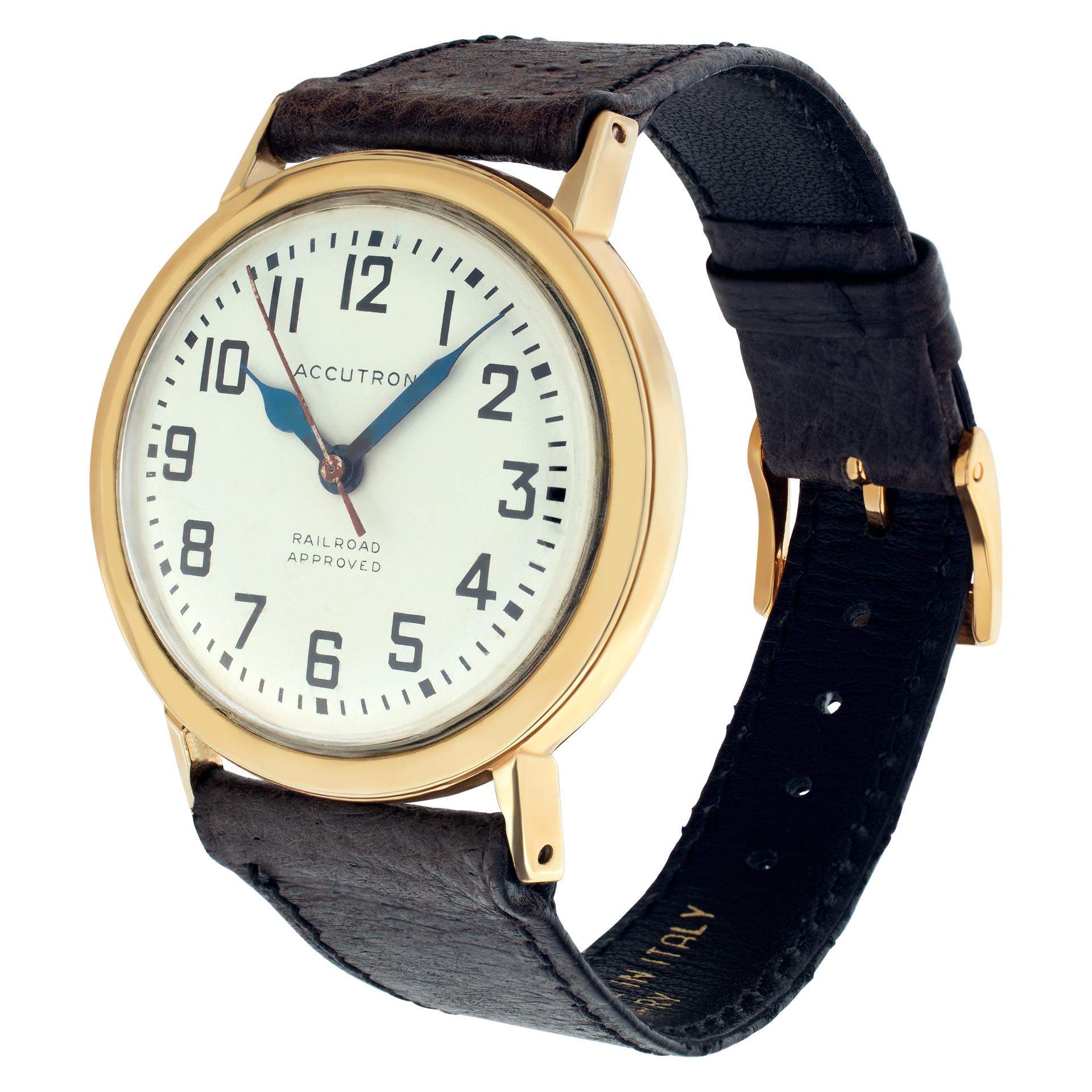 Vintage Accutron Railroad in gold fill with a white dial set with applied Arabic hour markers on a leather strap on a leather band with a gold fill tang buckle. Quartz tuning fork mechanism w/sweep seconds. Circa 1965. Fine Pre-owned Accutron Watch.