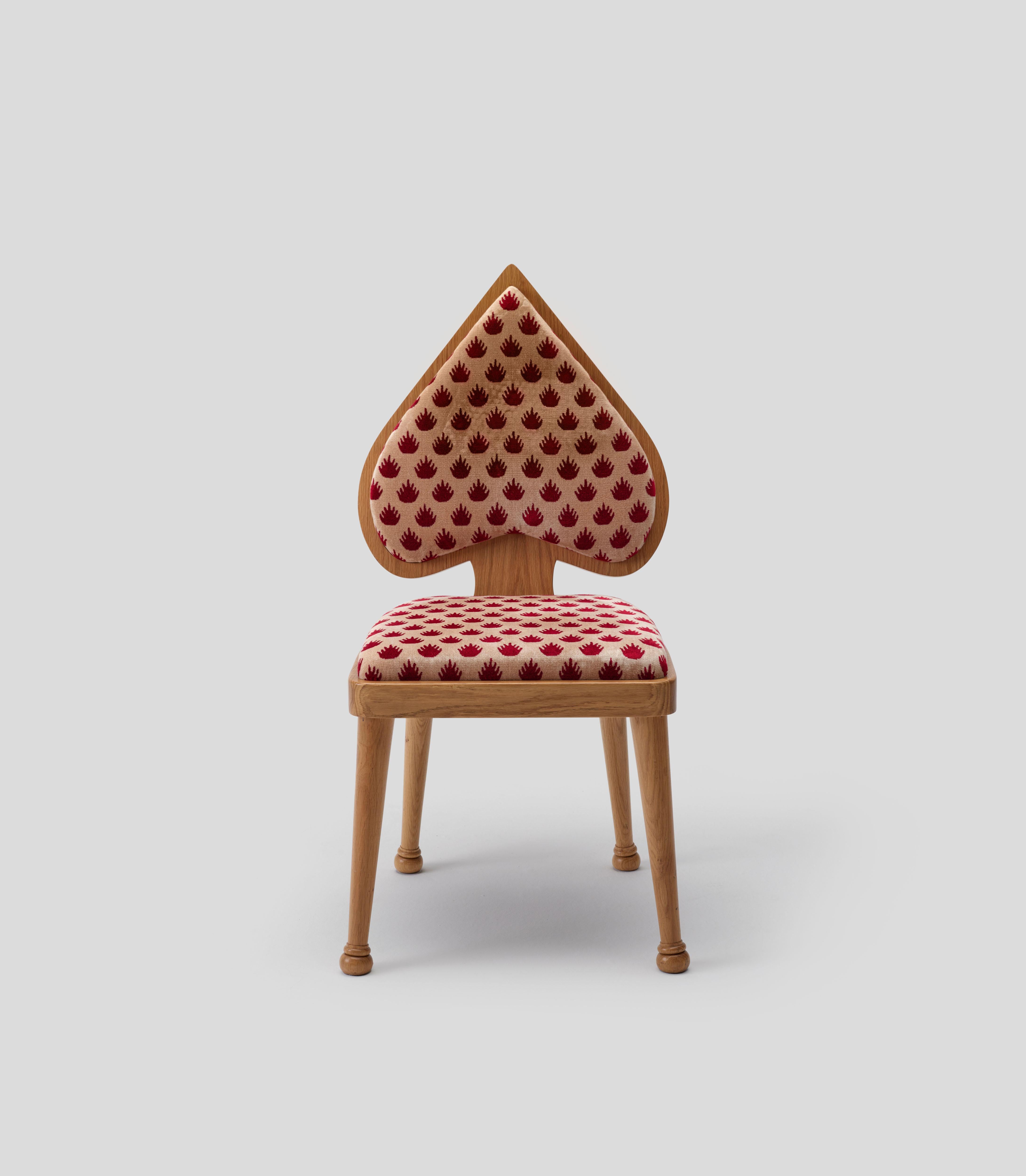 Drawing inspiration from the Queen of Spades, these chairs embody a spirited elegance, making them perfect as standout dining or accent pieces. Available with two distinct leg styles, they can be crafted from either oak or cherry wood. The
