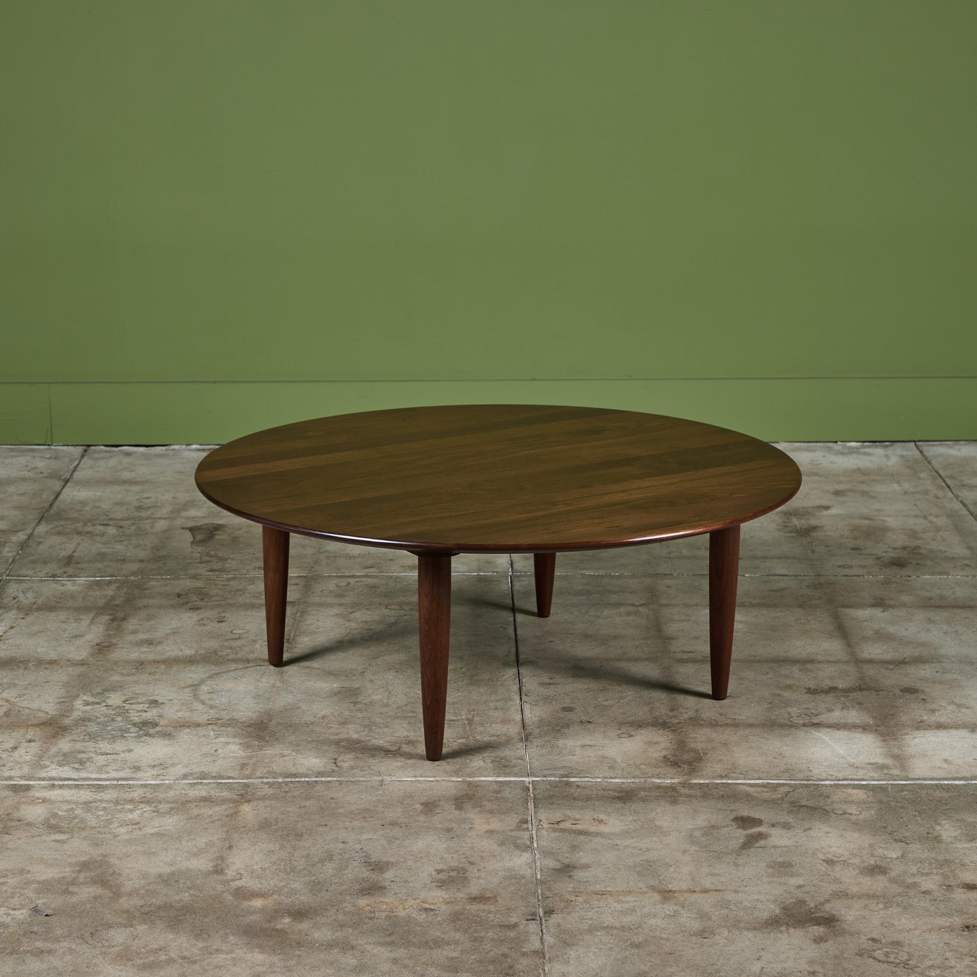 Produced by Ace-Hi of Gardena, California, the Prelude line of furniture features solid walnut construction and simplified (but never reductive) purity of form. This Prelude table has a round shape. The expertly joined walnut wood has a stunning