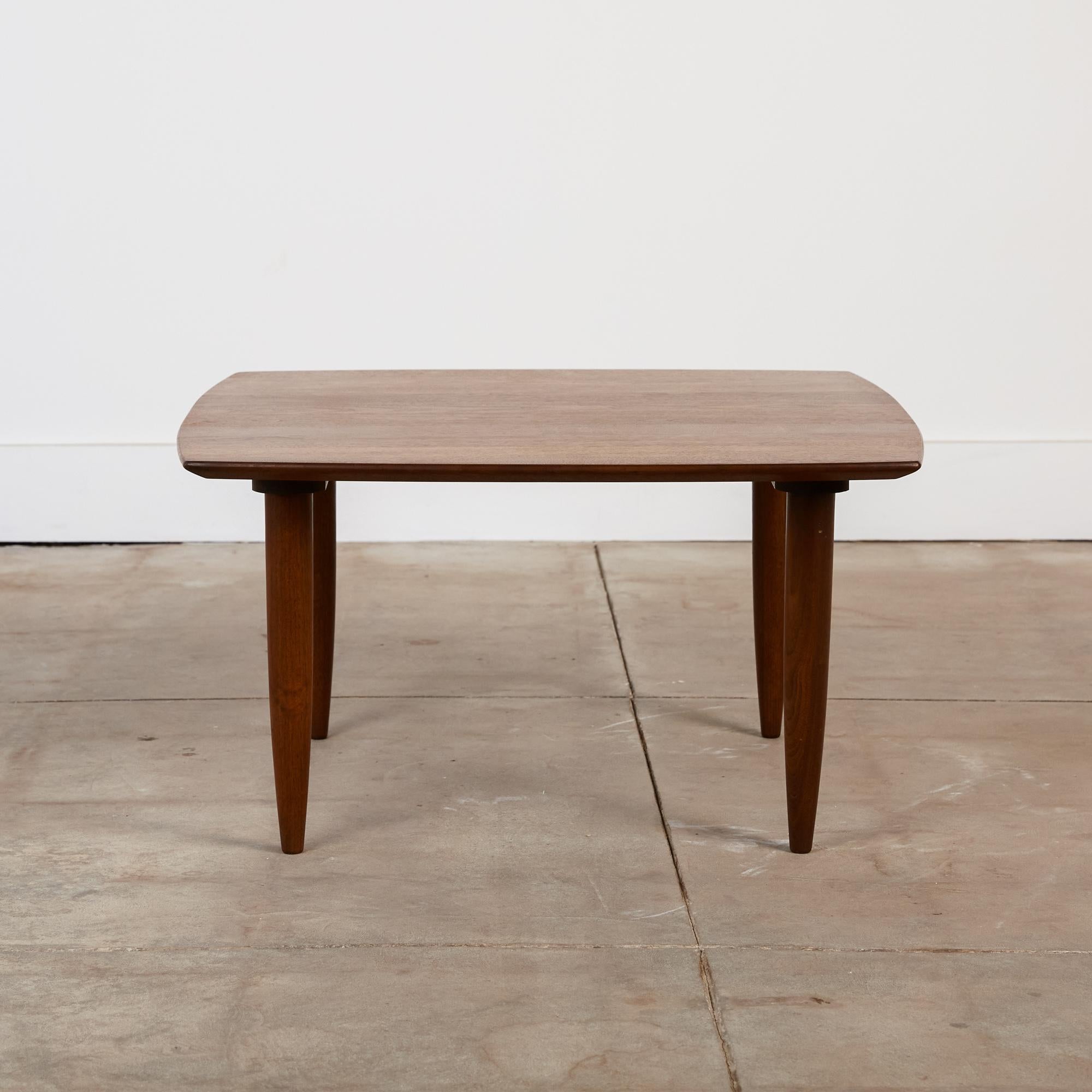 Produced by Ace-Hi of Gardena, Calif., the Prelude line of furniture featured solid walnut construction and simplified (but never reductive) purity of form. This Prelude table has a rounded square shape, with slightly bowed edges and a tidy corner
