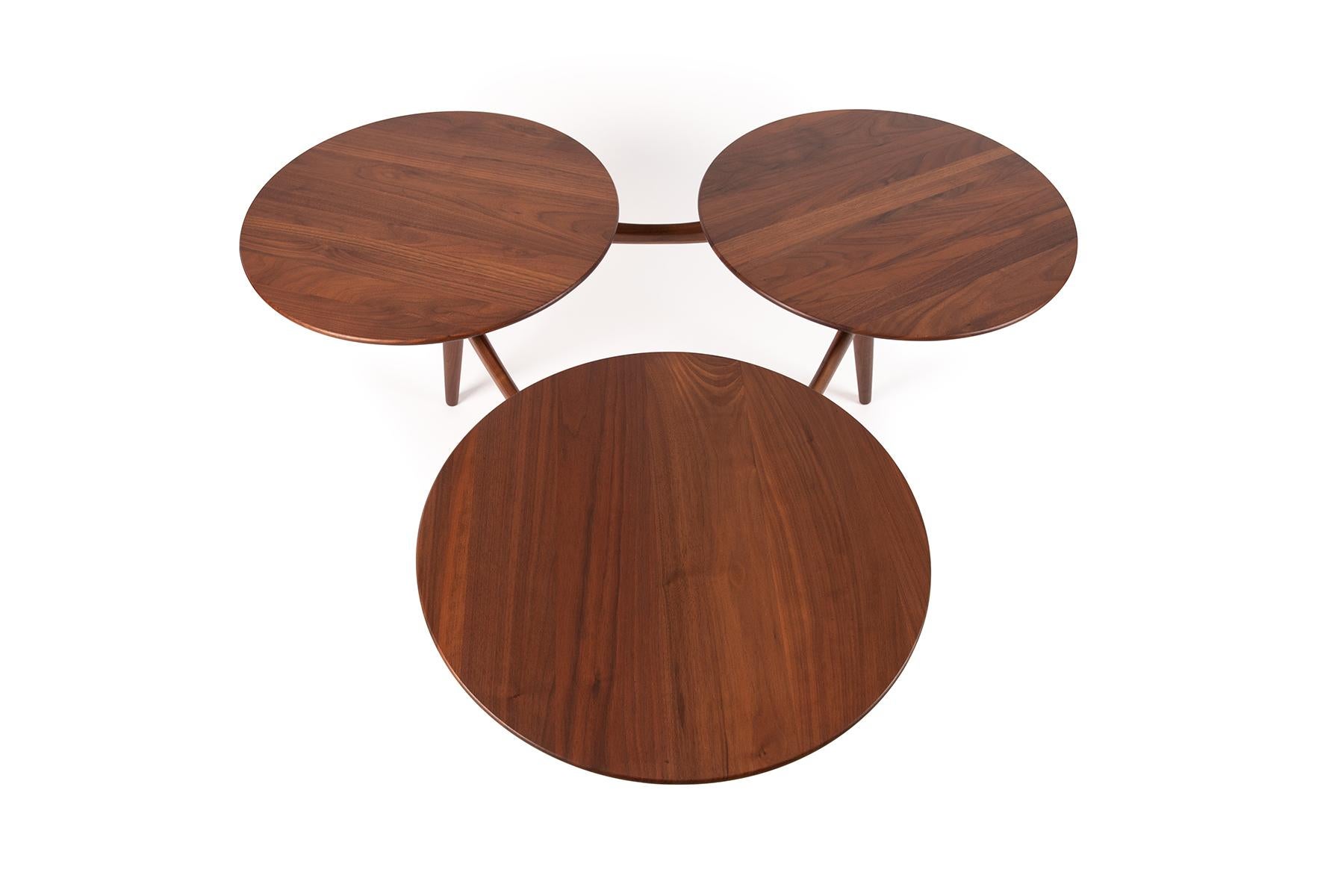 This early 1960's walnut coffee table by ACE-HI features 3 circle top surfaces. Newly finished.