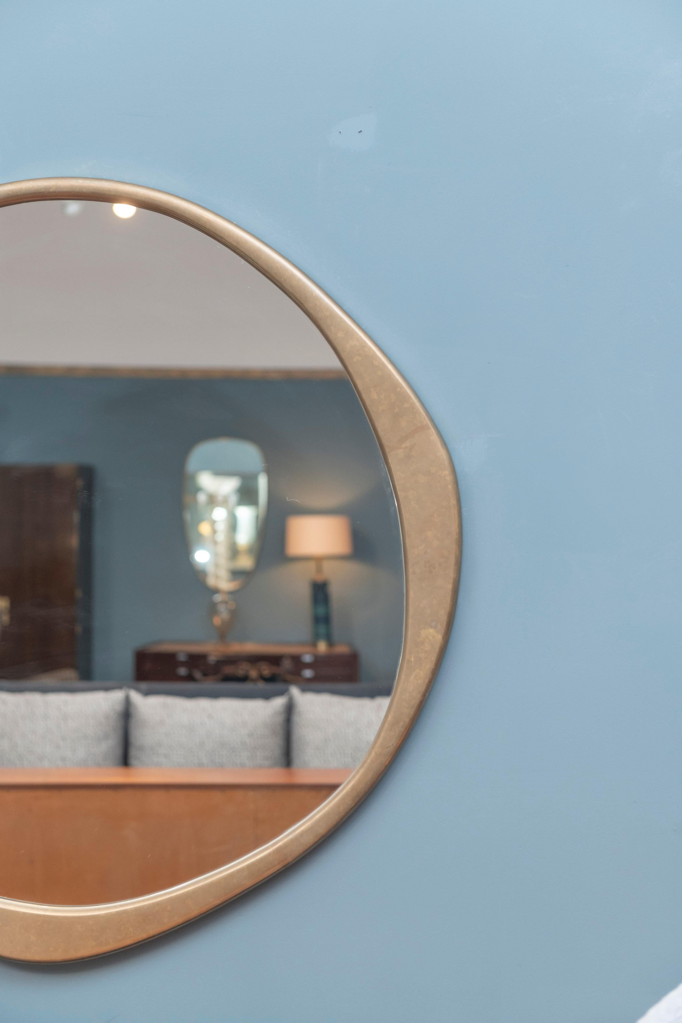 A.Cepa solid cast bronze large size wall mirror with hand patination by Konekt, PA. tiny scratch to mirror plate only noticeable upon close up inspection.