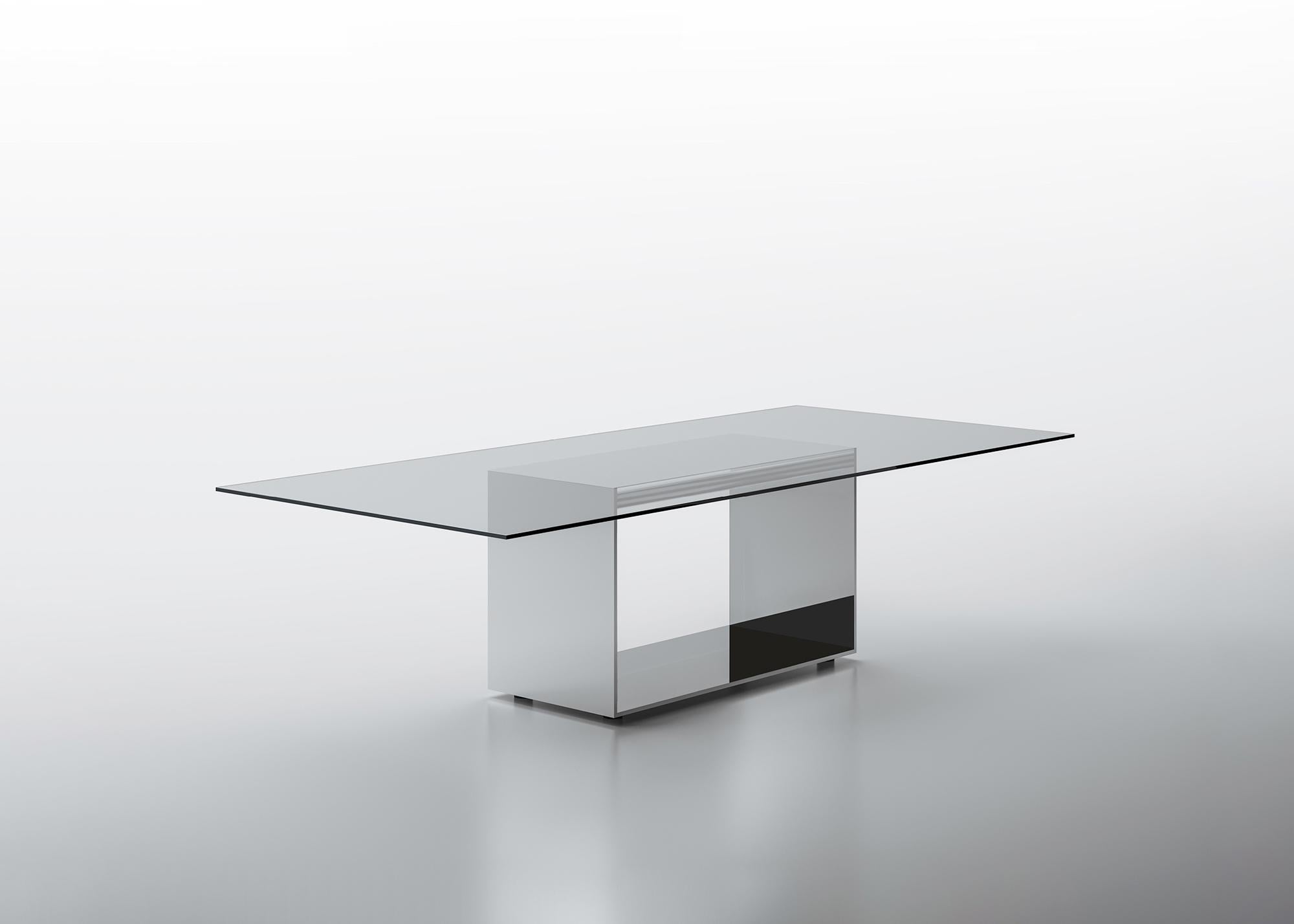 Judd is a system of tables that combines an essential line with rich materials. An innovative structural panel forms the base of the table. The exterior is in bright polished stainless steel, the interior is finished with mirror, lead mirror or