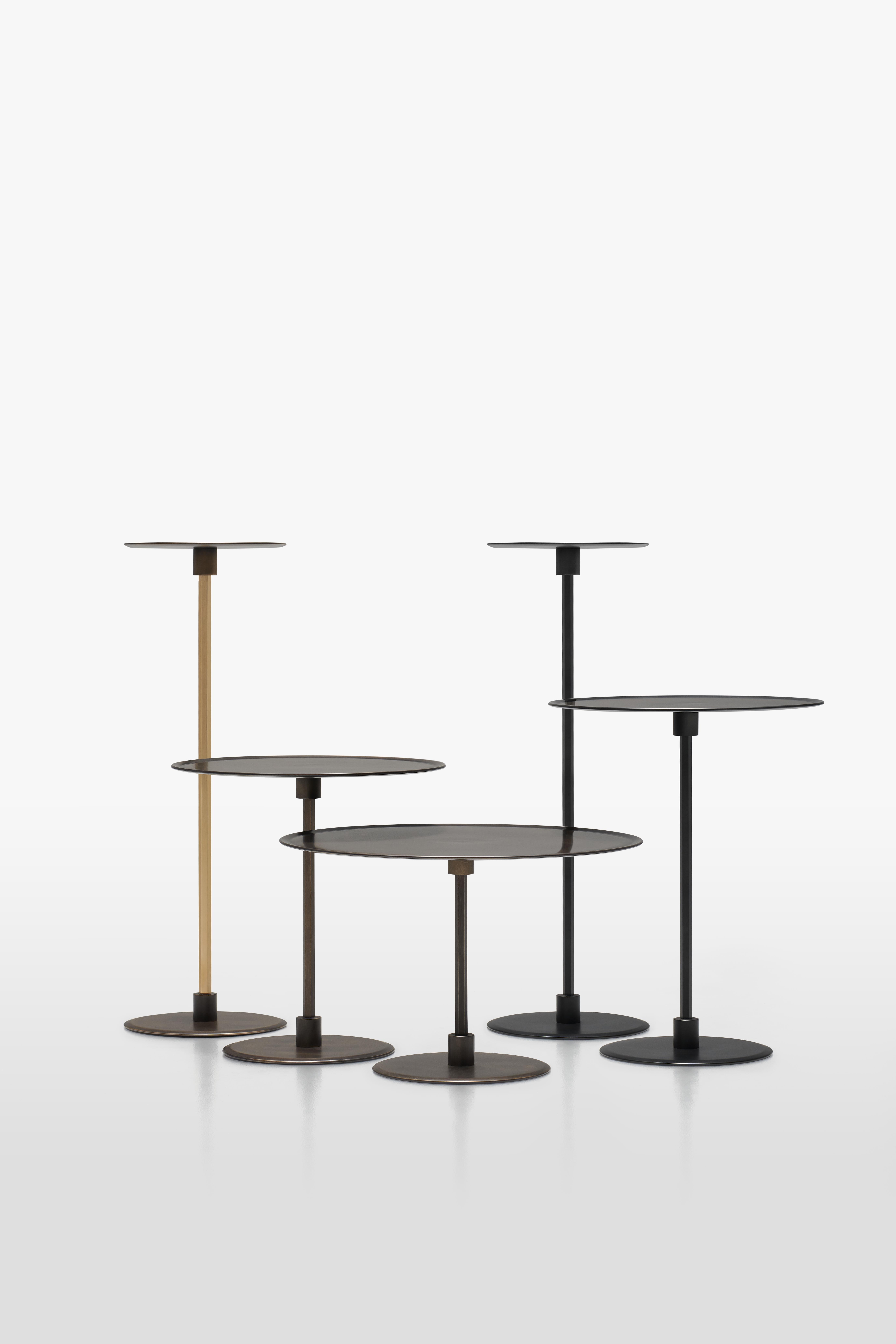 Architect Gianfranco Frattini signed Gong, which was unveiled for the first time in 1987.
Gong is a range of round metal tables of formal simplicity and clean lines, which are available in various sizes and heights, and can be used individually or