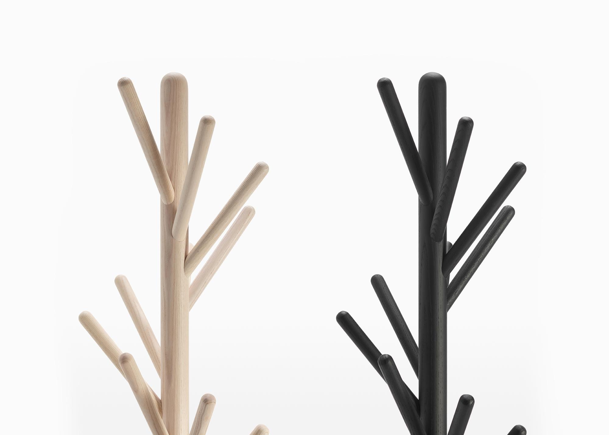 Coat stand in solid wood ash, stained in the colors black, natural bleached, red. Version 1 to be placed against the wall, version 2 freestanding with base in metal painted micaceous gray.

Born in Milan in 1920, Magistretti enrolled in the