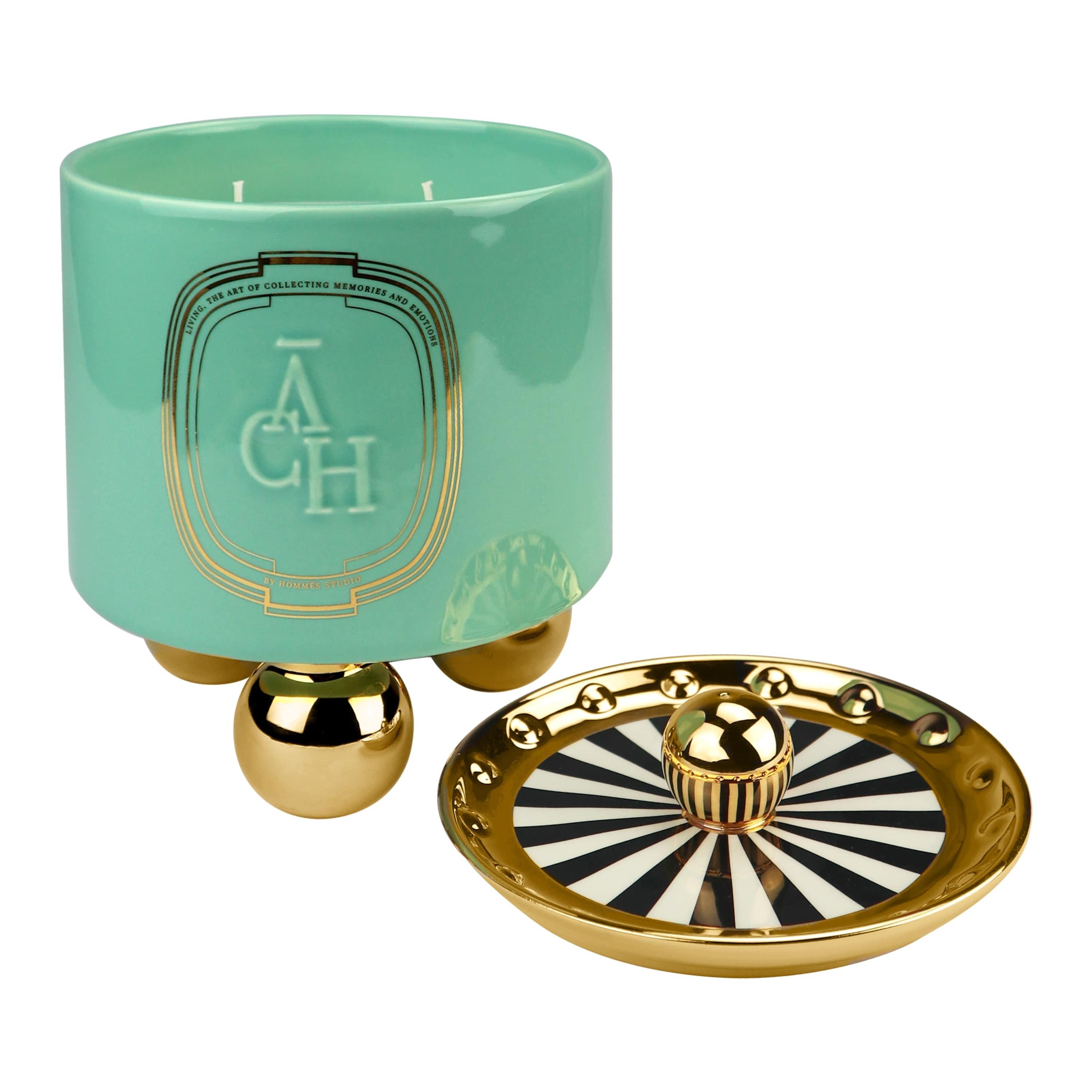 Candle Bois Oud Scented, Green Ceramic Candleholder Natural Fragrance, In Stock

Achi candle releases a hypnotic perfume adding extra value to a space thanks to its eye-catching container design. The natural composition of scents promises to excite