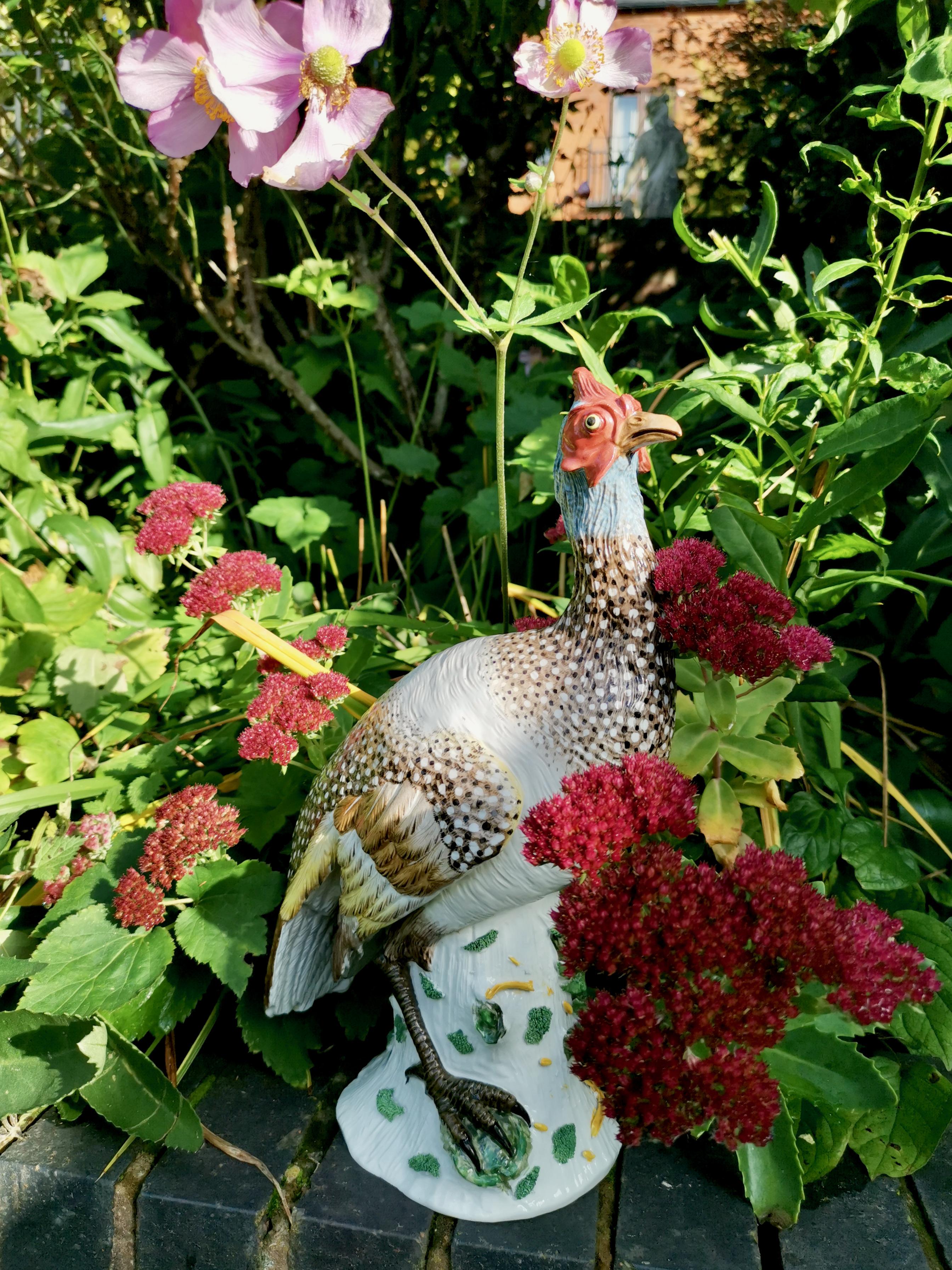 This is a spectacular large guinea fowl made in porcelain by Achille Bloch in Paris between 1900 and 1926.
 
The Achille Bloch factory started its life as Porcelaine de Paris founded by Jean-Marx Clauss in 1829. If took inspiration from the great