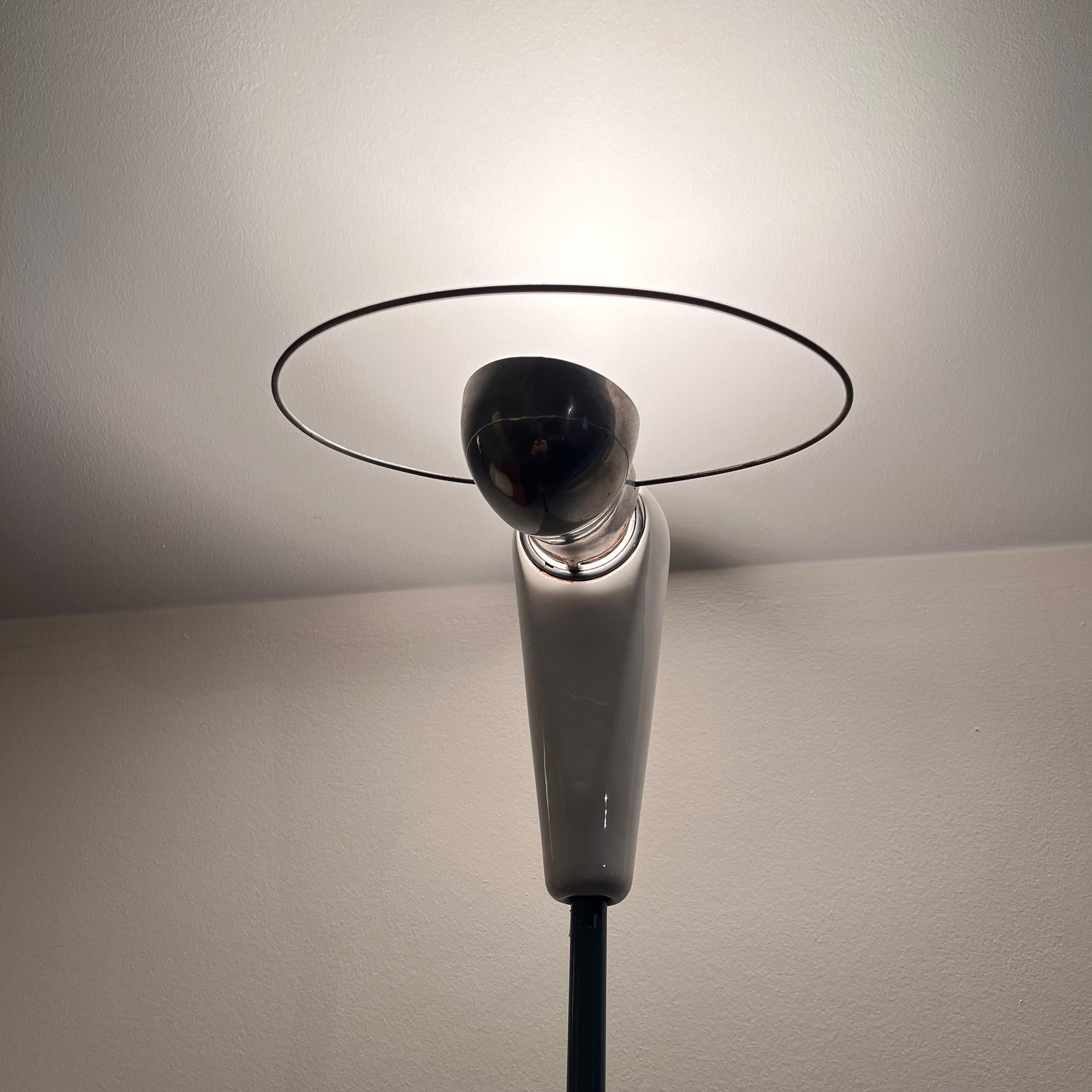 Achille castiglioni (1918-2002).

Bibip

A ceramic and metal floor lamp.
The swivel aluminum reflector with a circular handle connected with a white ceramic head on a steel slender stem on a hemispherical white ceramic base.
Produced by Flos,