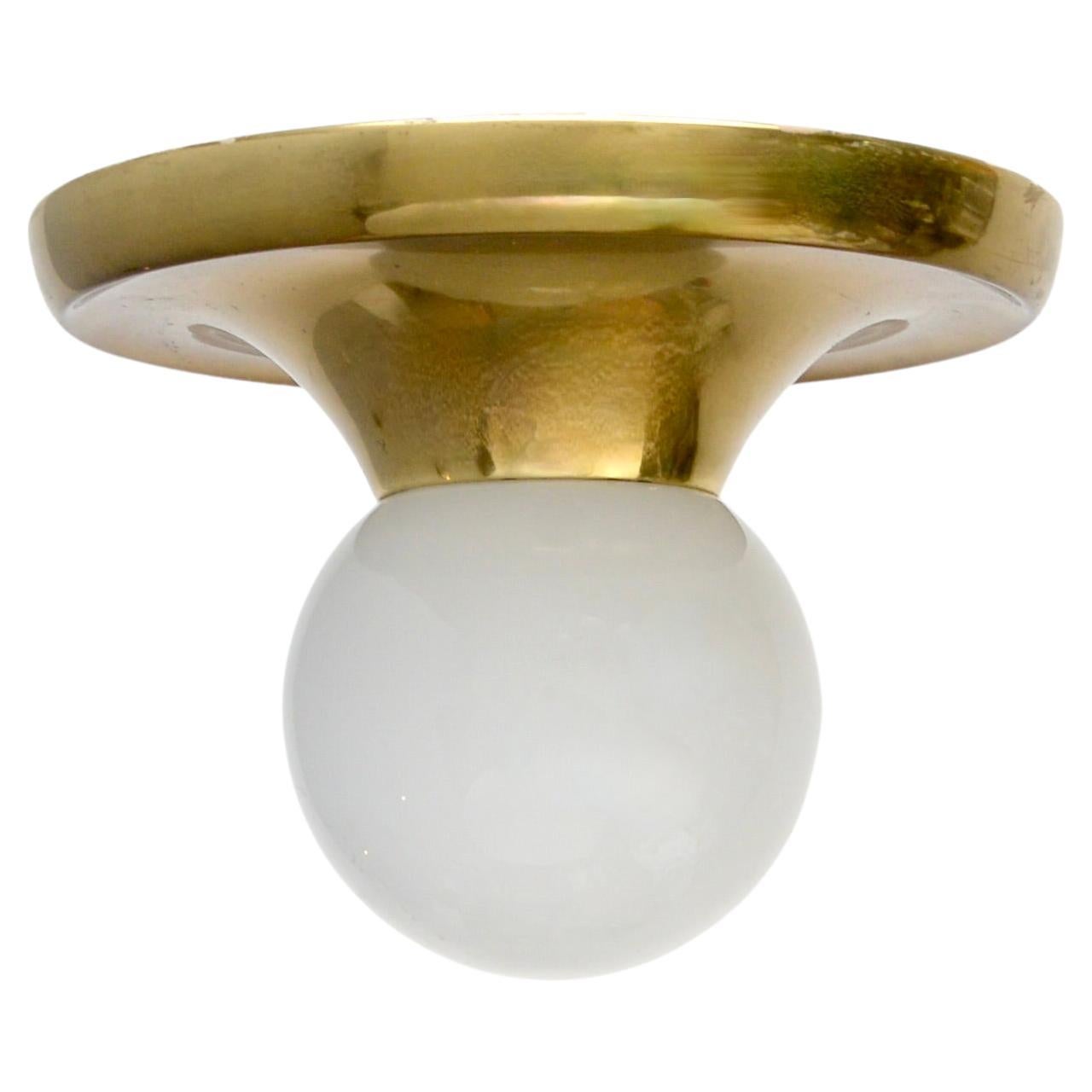 From the period 2 midcentury flush mounts by Achille Castiglioni from Italy, with original brass and glass finish. Finishes slightly differ between the two. Partially restored and rewired with 1 E26 medium based socket per flush mount. For use in