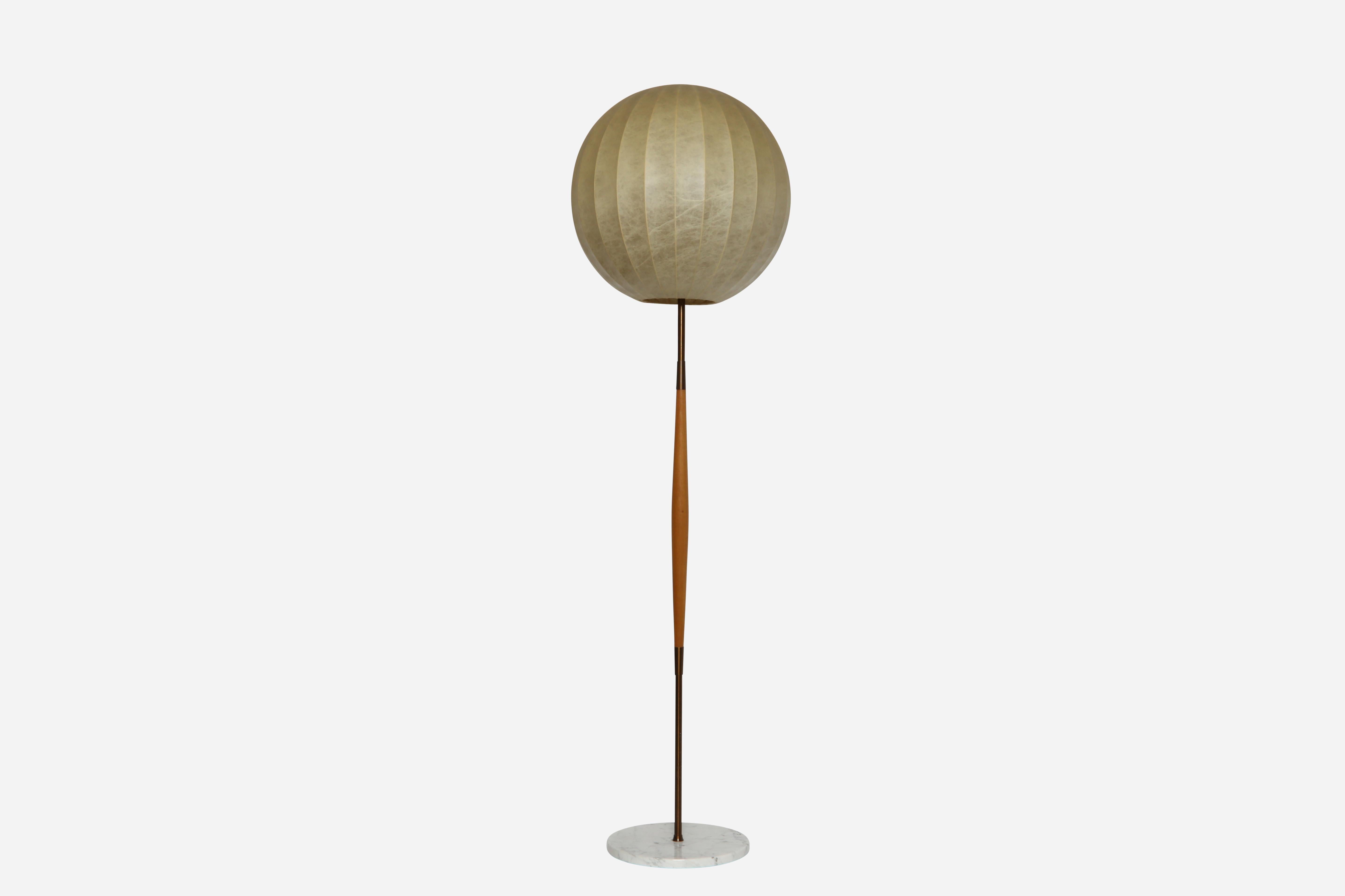 Cocoon floor lamp attributed to Achille Castiglioni for Flos.
Made in Italy in 1960s.
Resin shade, marble base, brass and wooden stem.
Has foot switch.
Takes one medium bulb.
Complimentary US rewiring upon request.

We take pride in bringing vintage
