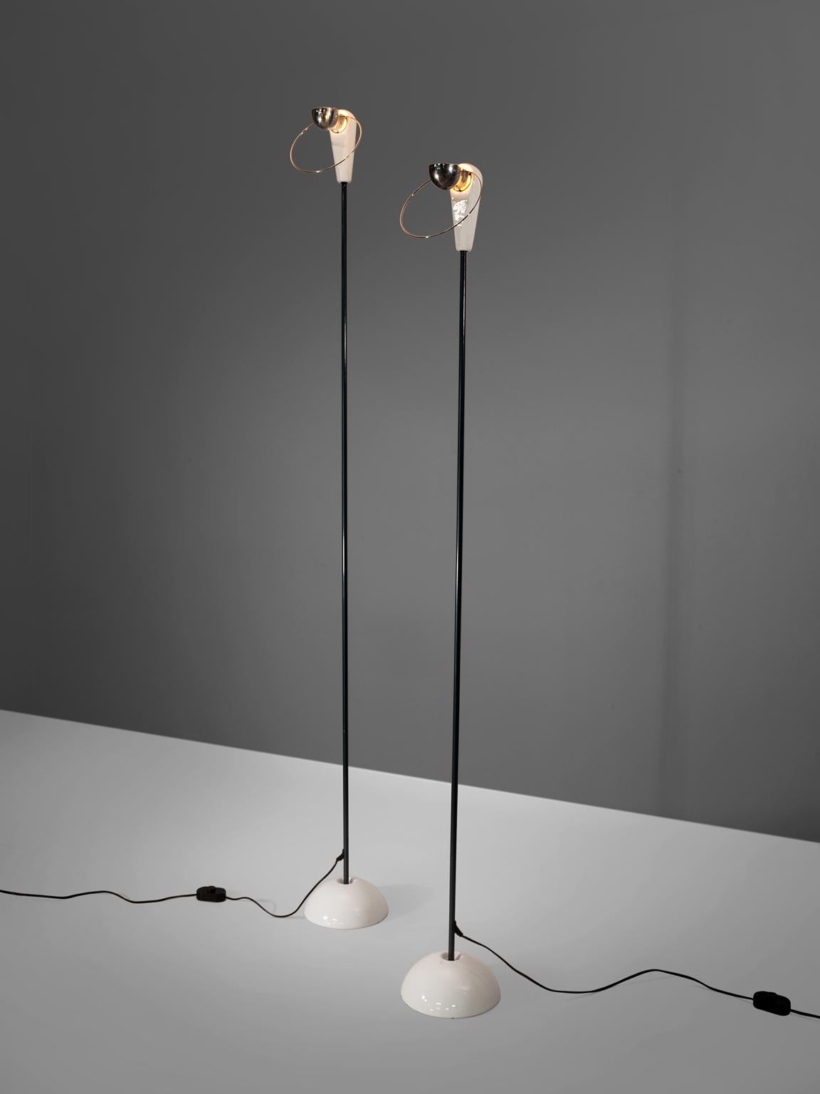 Achille Castiglioni for Flos, set of two 'Bip- Bip' floor lamps, made in aluminium and porcelain, Italy, 1976. 

These two skinny floor lamps are standing on a ceramic round base. The body of these lamps is made out of aluminium. The shape of