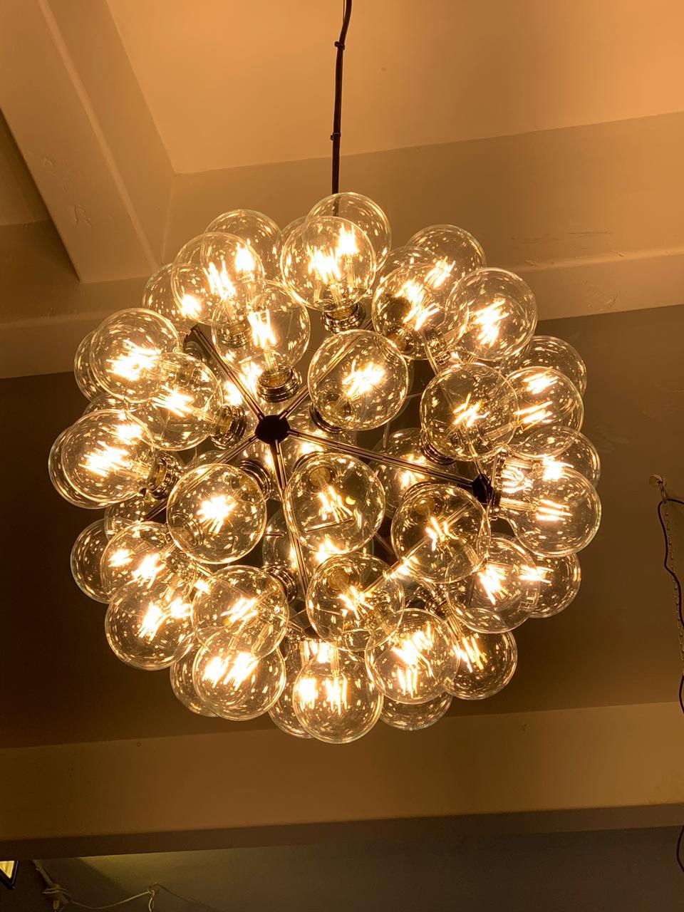 Striking Taraxacum 88 S1 ceiling lamp by Italian designer Achille Castiglioni. The icosahedron shaped design uses 60 LED bulbs.