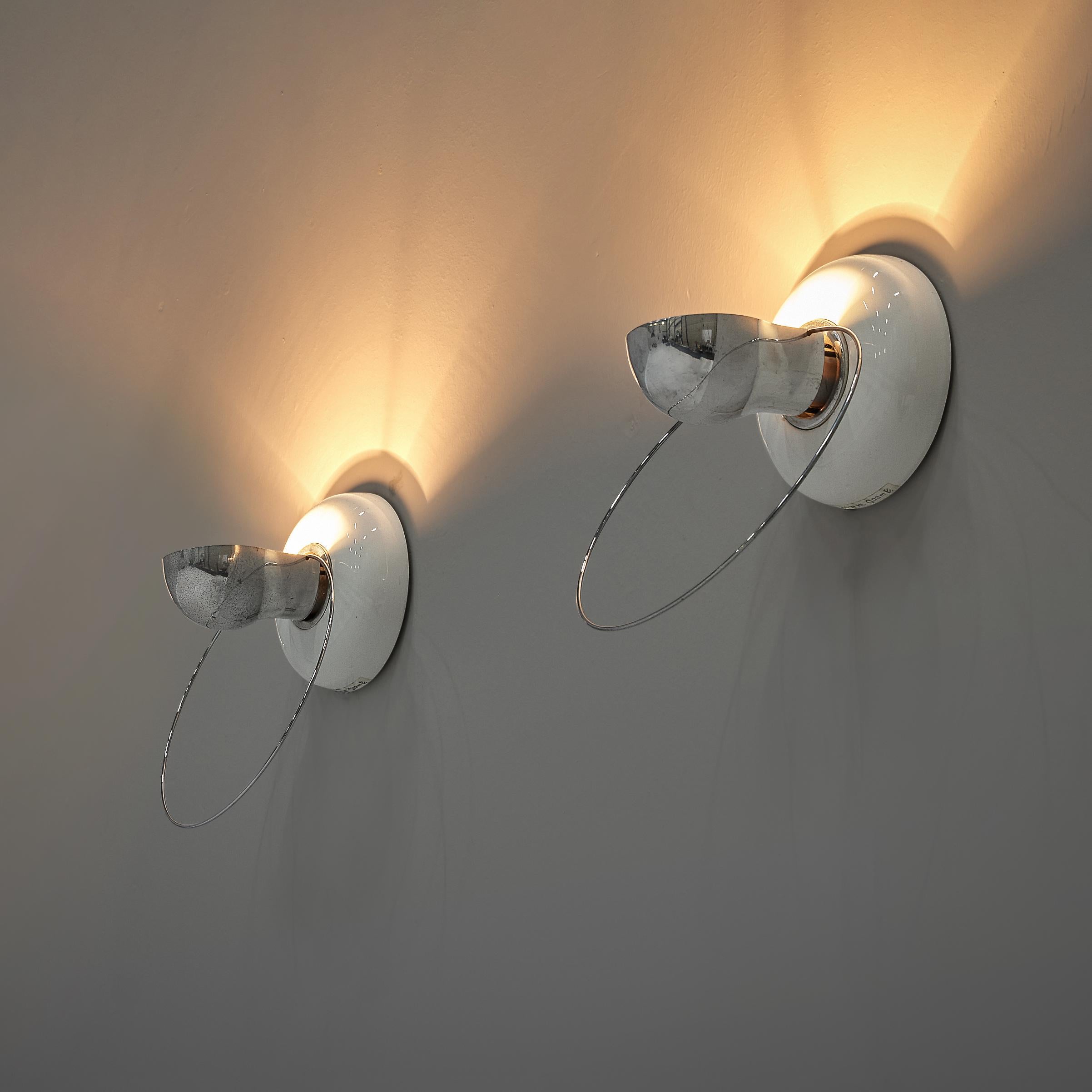 Achille Castiglioni for Flos, wall lamps model ‘Bi Bip’, ceramic, steel, Italy, 1977

Delicate wall lights designed by Achille Castiglioni in 1977. The forms but also the materials make this lamp special in its expression. From a round base in