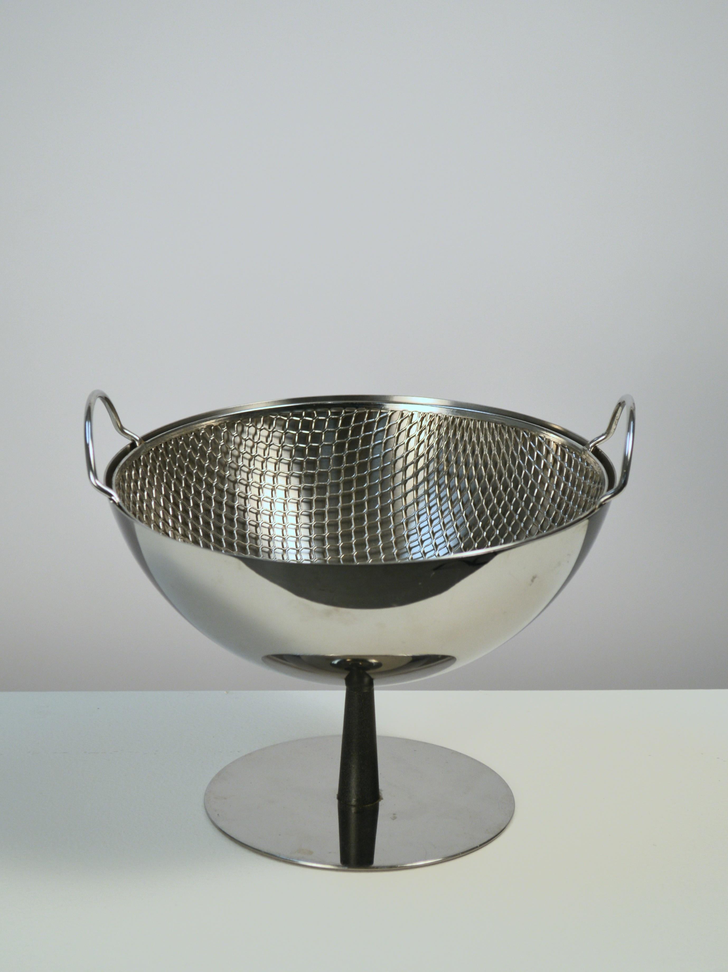 Post-modern stainless steel and aluminum fruit bowl designed by Achille Castiglioni in 1995, for Alessi Italy. Free standing dish features a built-in stainless steel strainer for rinsing fresh fruits, and freshness maintaining air circulation. This