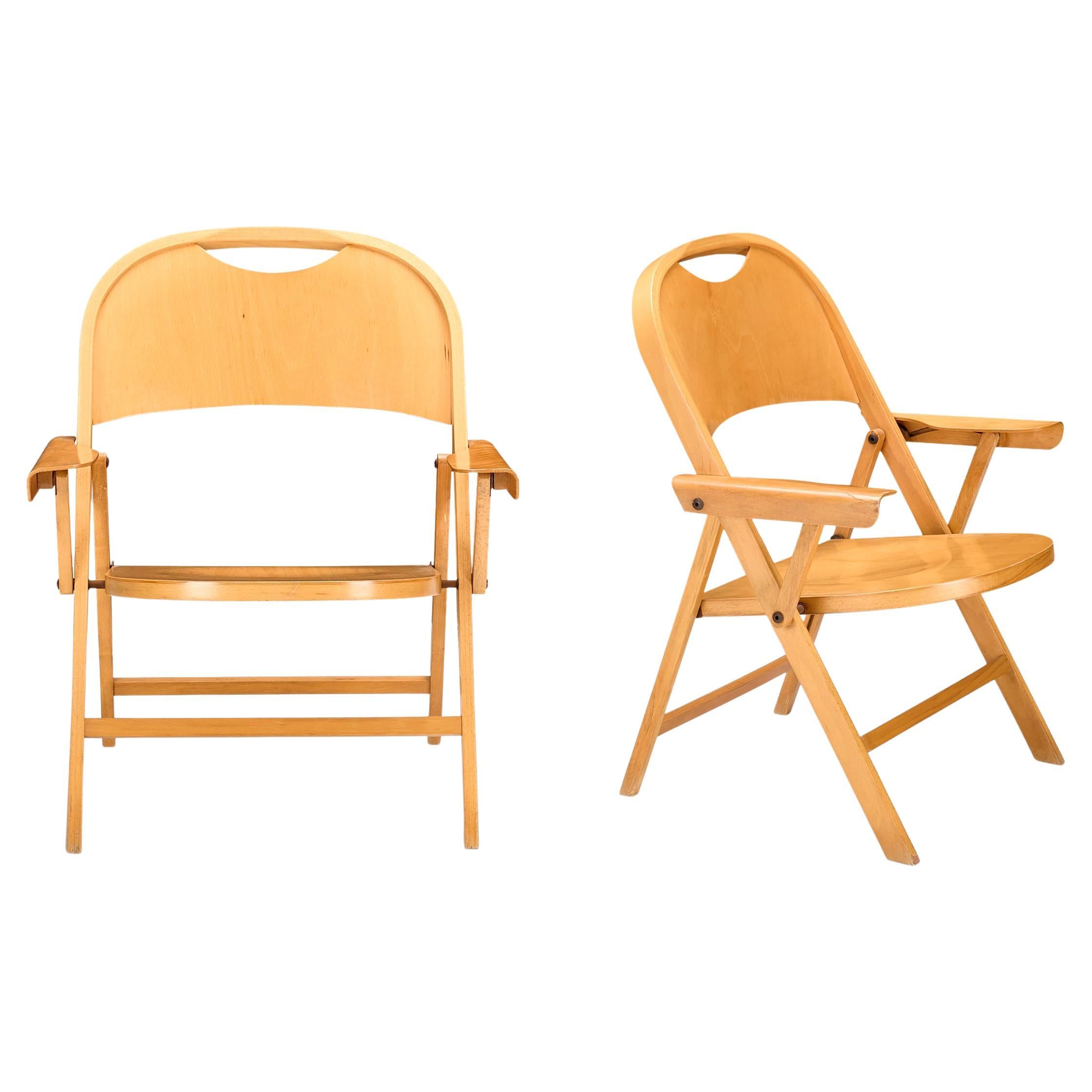 Ginevra folding chair, design by Achille Castiglioni for BBB emmebonacina with structure in varnished solid wood.

A clear example of functional design, Ginevra is light weight, foldable, has arms and quite comfortable.

Ginevra folding chair,