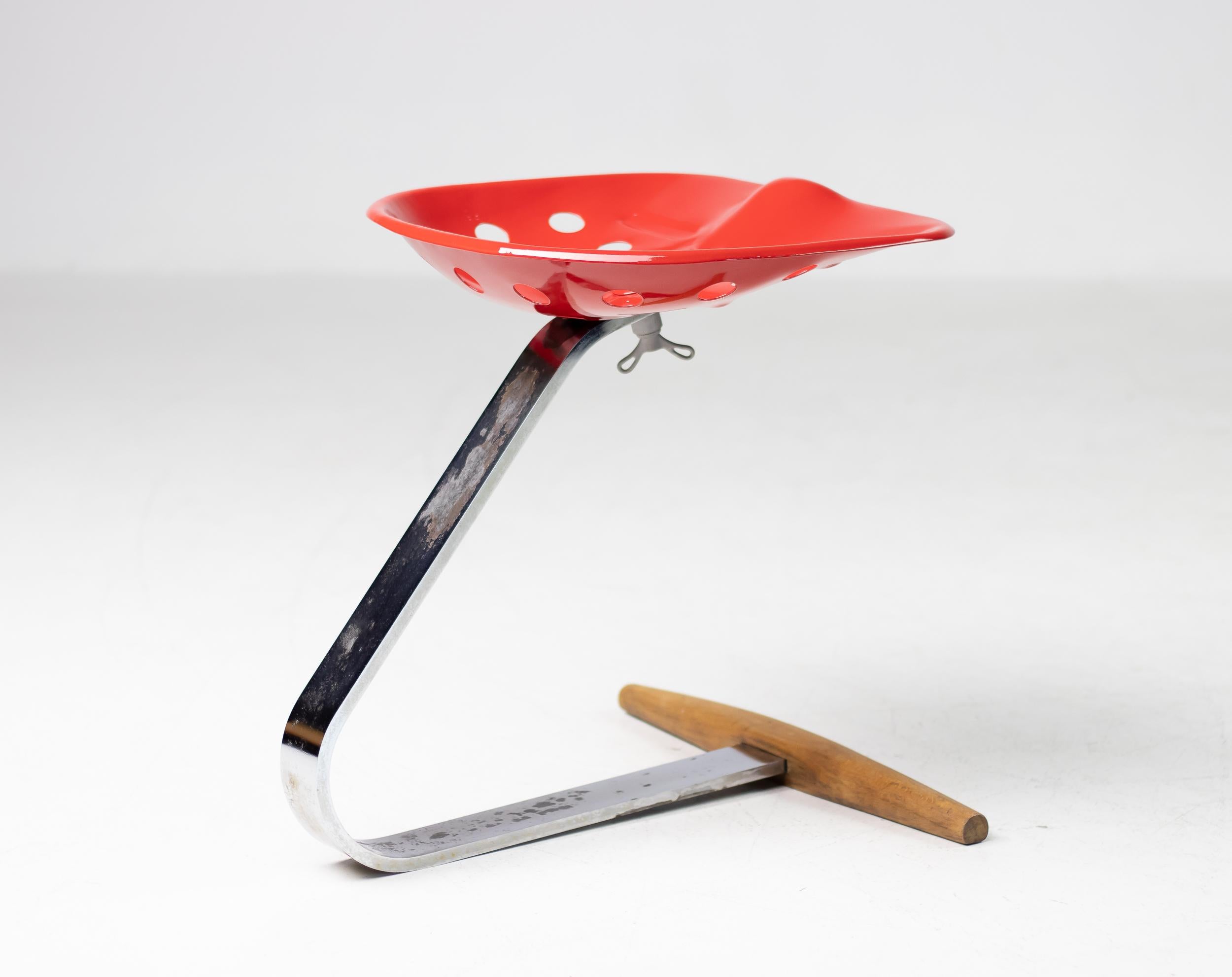 Very early bright red Mezzadro stool designed by Achille Castiglioni for Zanotta.
In the hands of the Castiglioni Brothers, the Mezzadro stool for Zanotta transforms a simple tractor seat into an iconic object, altering the history of design and the