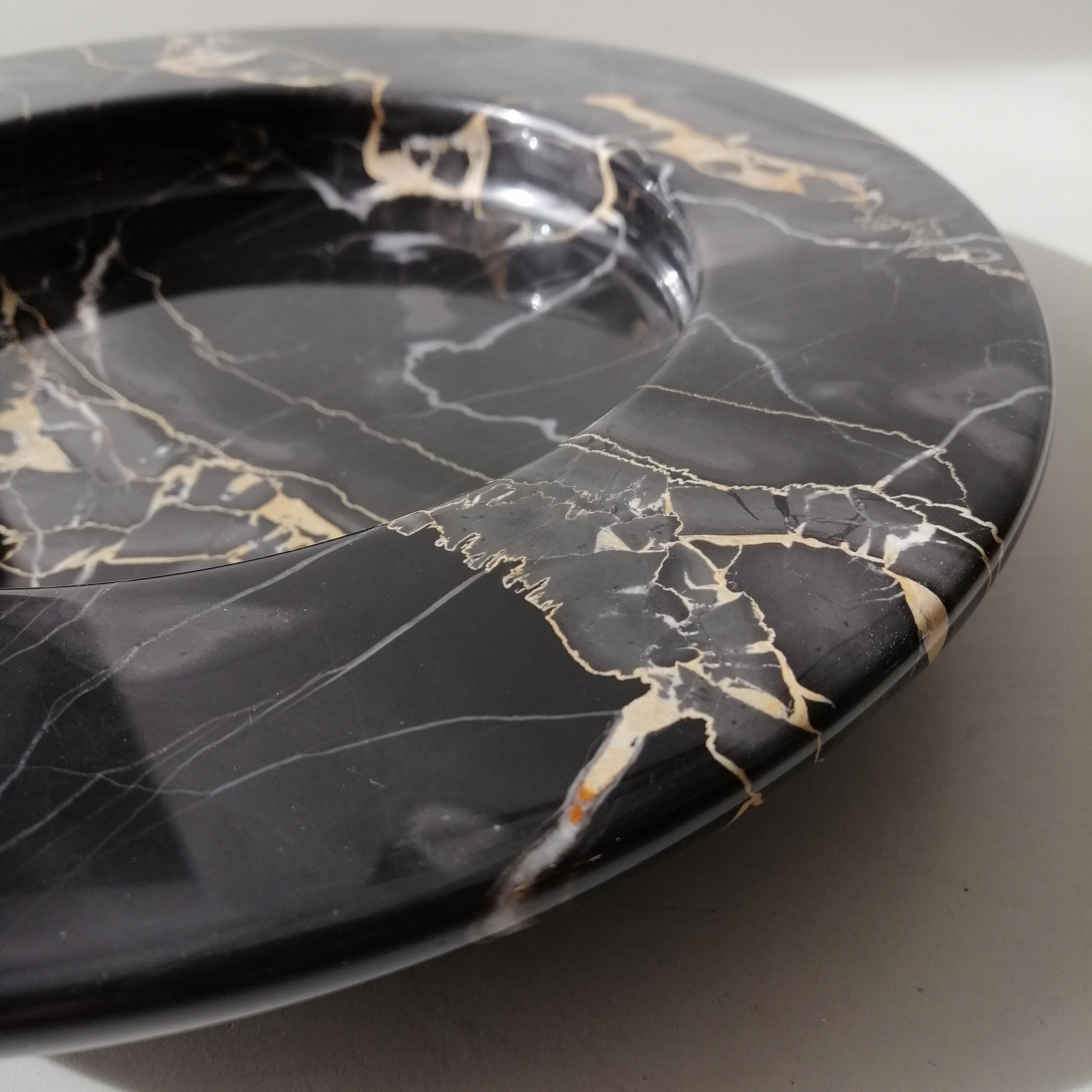 Sculptural massive black portoro marble bowl designed by Achille Castiglioni for Up & Up in the 1980s. Beautiful bowl or centerpiece, in perfect condition with its original sticker.