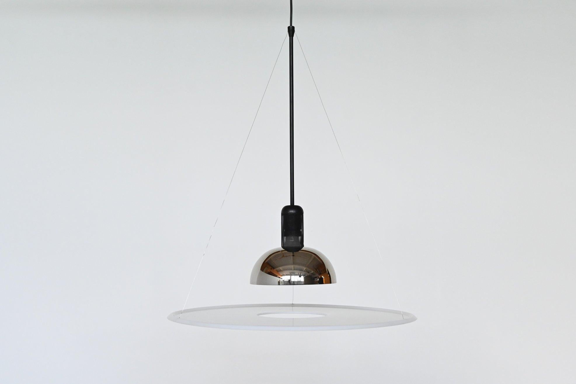 Beautiful MoMa design collection award winner model Frisbi 850 pendant lamp designed by Achille Castiglioni for Flos, Italy, 1970. As its name suggests, the lamp was inspired by the Classic flying disk. It has unique combination of minimal shapes