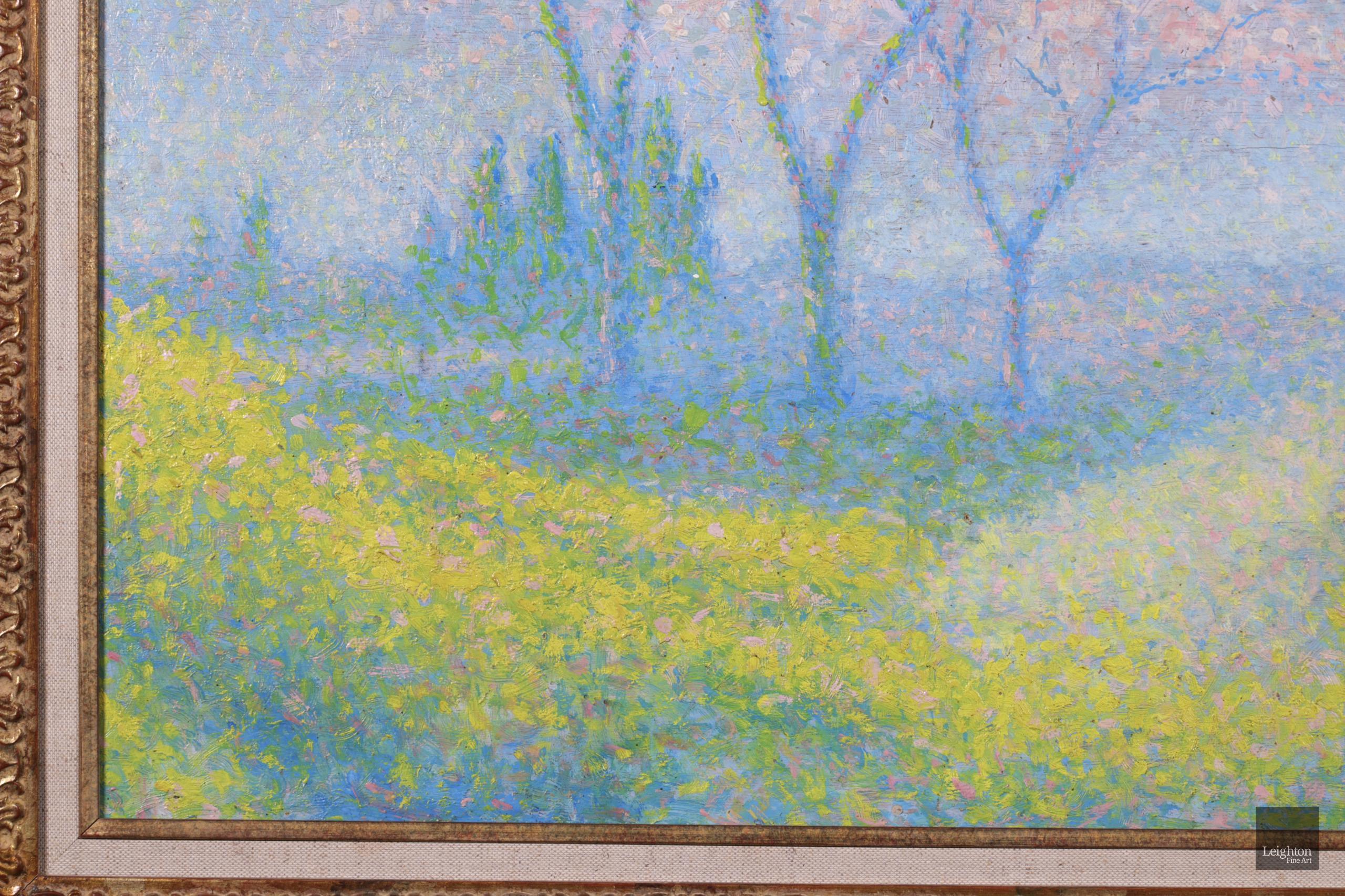 Stunning pointillist landscape oil on panel circa 1920 by French neo-impressionist painter Achille Lauge. The work depicts a spring landscape. In the centre are three tall trees covered in white and pink blossom. The trees are surrounded by fields