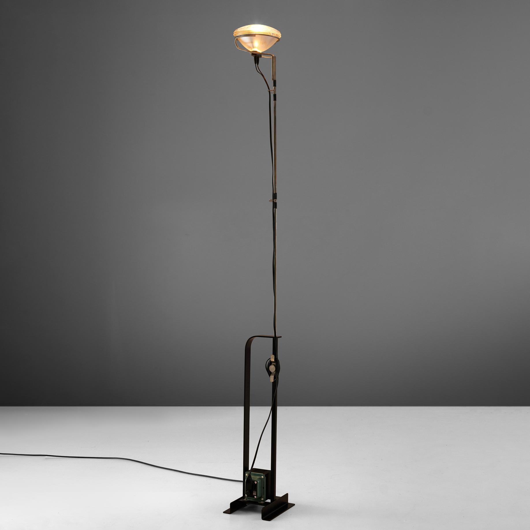 Achille & Pier Castiglioni for FLOS, 'Toio' floor lamp, metal, chrome, Italy, 1962.

A floor lamp that encompasses Castiglioni's idea of a ready-made concept. A car headlight is used as lamphead. The foot consists of a transformer, which gives the