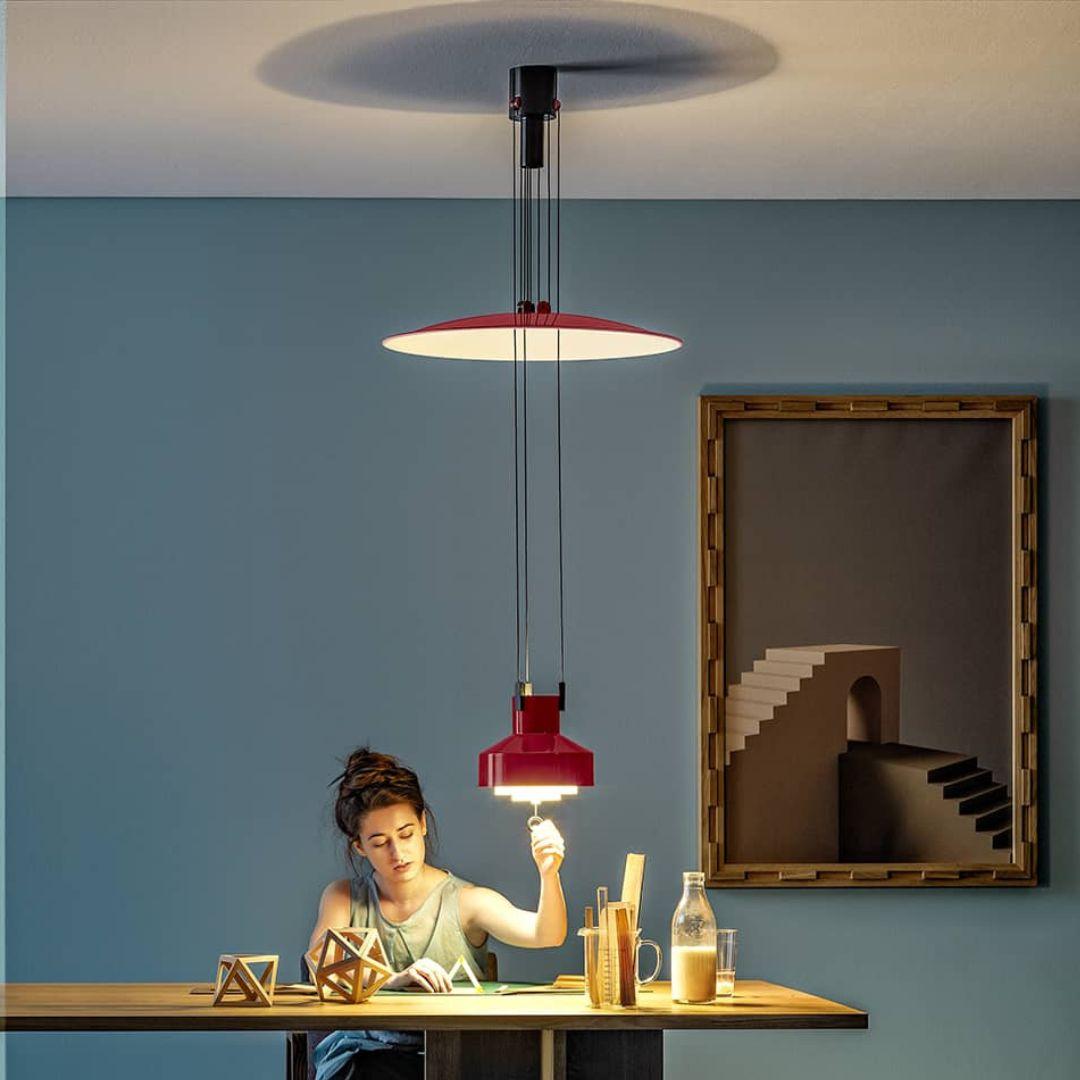 Achille & Pier Castiglioni 'Saliscendi' adjustable pendant in red for Stilnovo

Founded in 1946 in Milan, Stilnovo was one of the most innovative lighting companies in Italy during the Midcentury era, producing iconic pieces by such luminaries as
