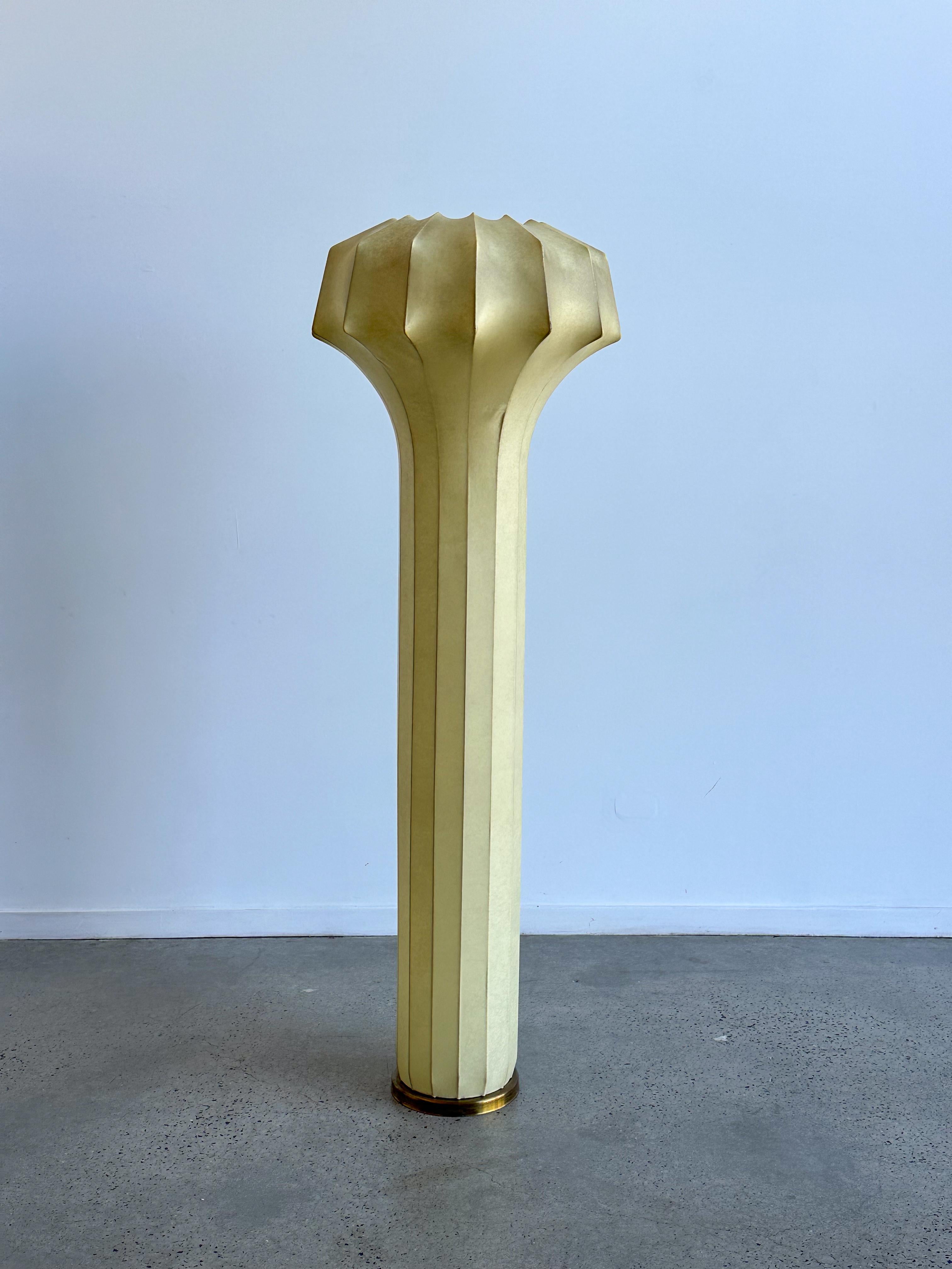 This extremely rare floor lamp features an internal steel structure with three light sockets and is covered with sprayed resin cover, which provides beautiful soft light effects. This piece is a stunning example of mid-century modern lighting