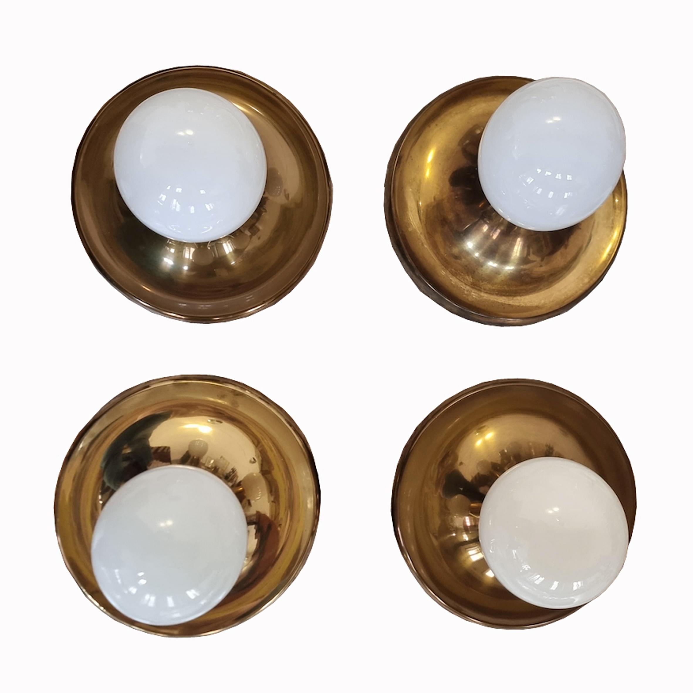 Achille Castiglioni (1918-2002) & Pier Giacomo Castiglioni (1913-1968)

Light Ball

A set of four wall lights, each with a circular polished brass reflecting disc centered with a white opaline glass ball.
Produced by Flos,