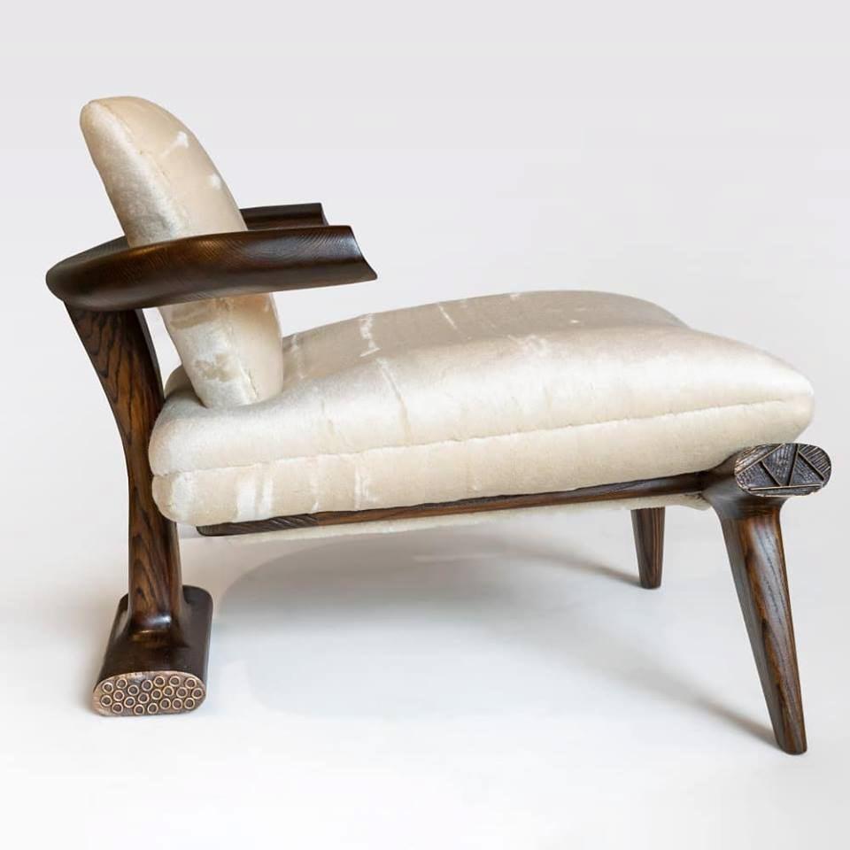 Amboseli, the latest in a series of extraordinary lounge chairs by Roman architect and designer Achille Salvagni, is a piece of superior proportions. Its plush seat and back are supported by a simple structure of supple walnut lines capped at their