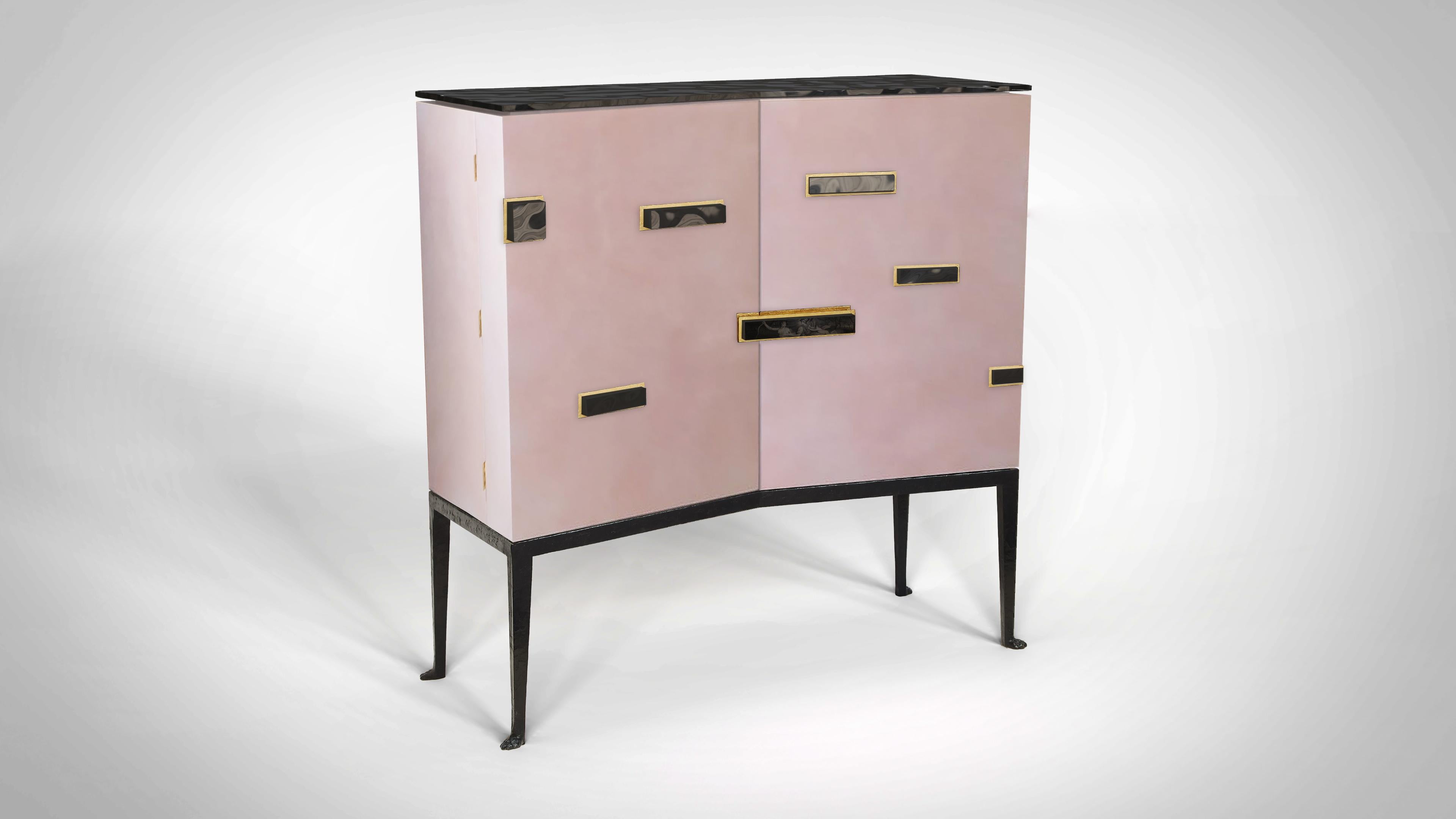 Dido is a one of a kind sculptural cabinet imagined by Achille Salvagni to explore the material combination of a rare pink parchment with murano glass, showing the versatility of these materials across large surfaces. This cabinet is dedicated to