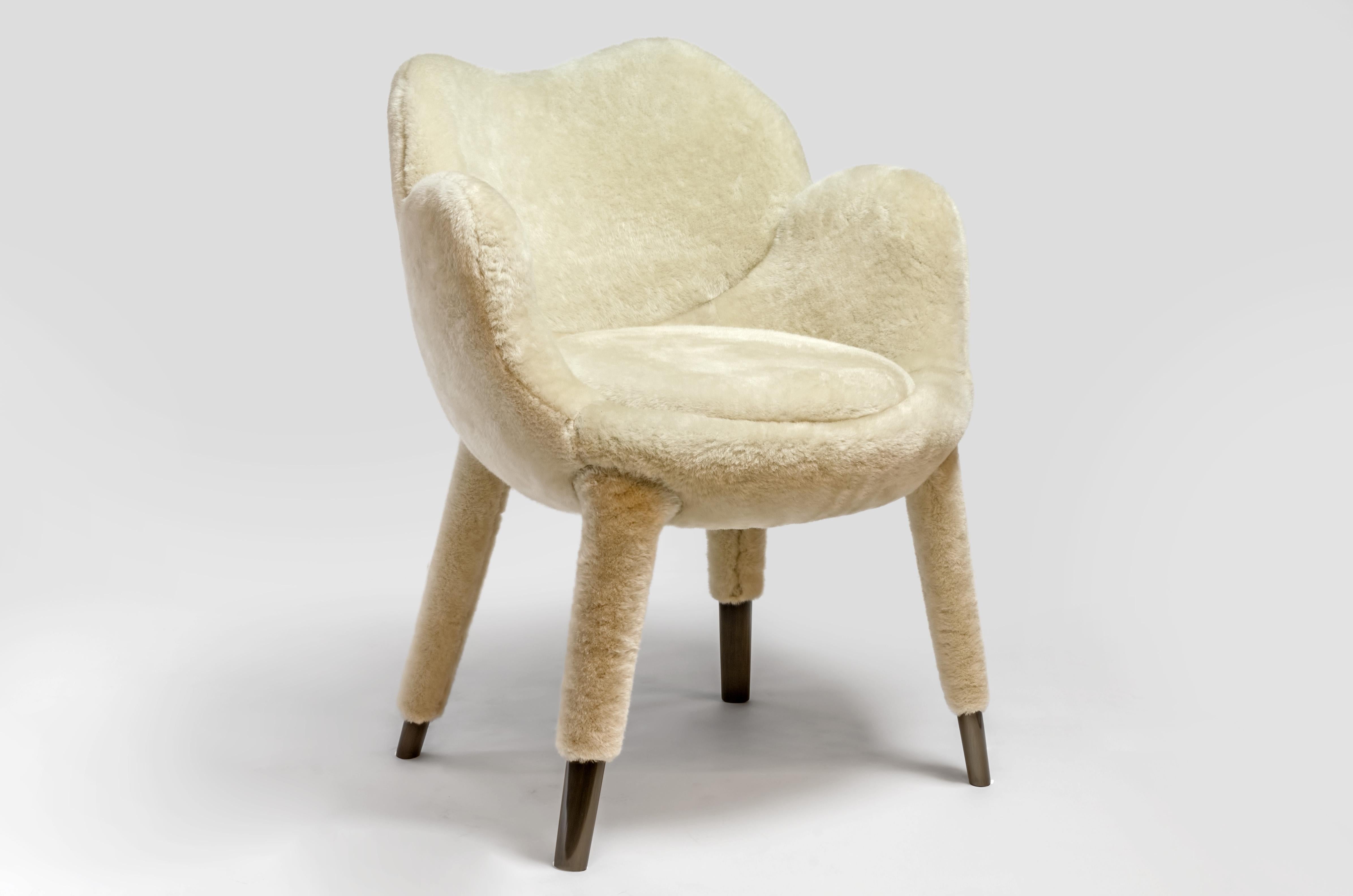 An elegant chair designed to break up the static nature of a table setting where all the chairs backs usually create a fixed line above the table surface. The backs of each of these chairs are formed from different organic shapes, taking their cues