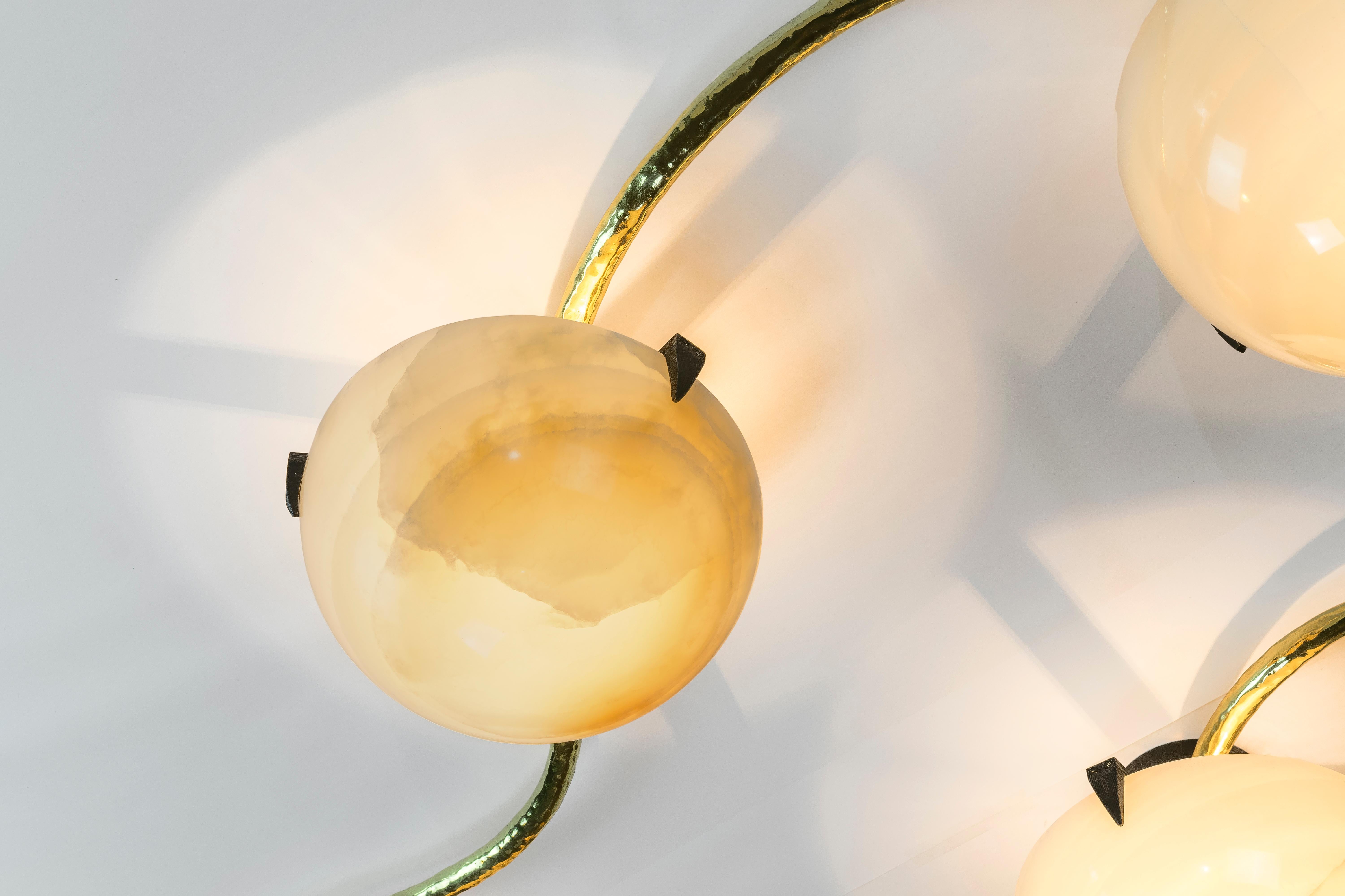 Achille Salvagni
Leros
2018
Back-lit hand carved onyx lamps; can be installed as a flush mounted ceiling chandelier or as a wall-mounted sconce. This work features a burnished cast bronze structure and hand-engraved brass clasps. Inspired by a
