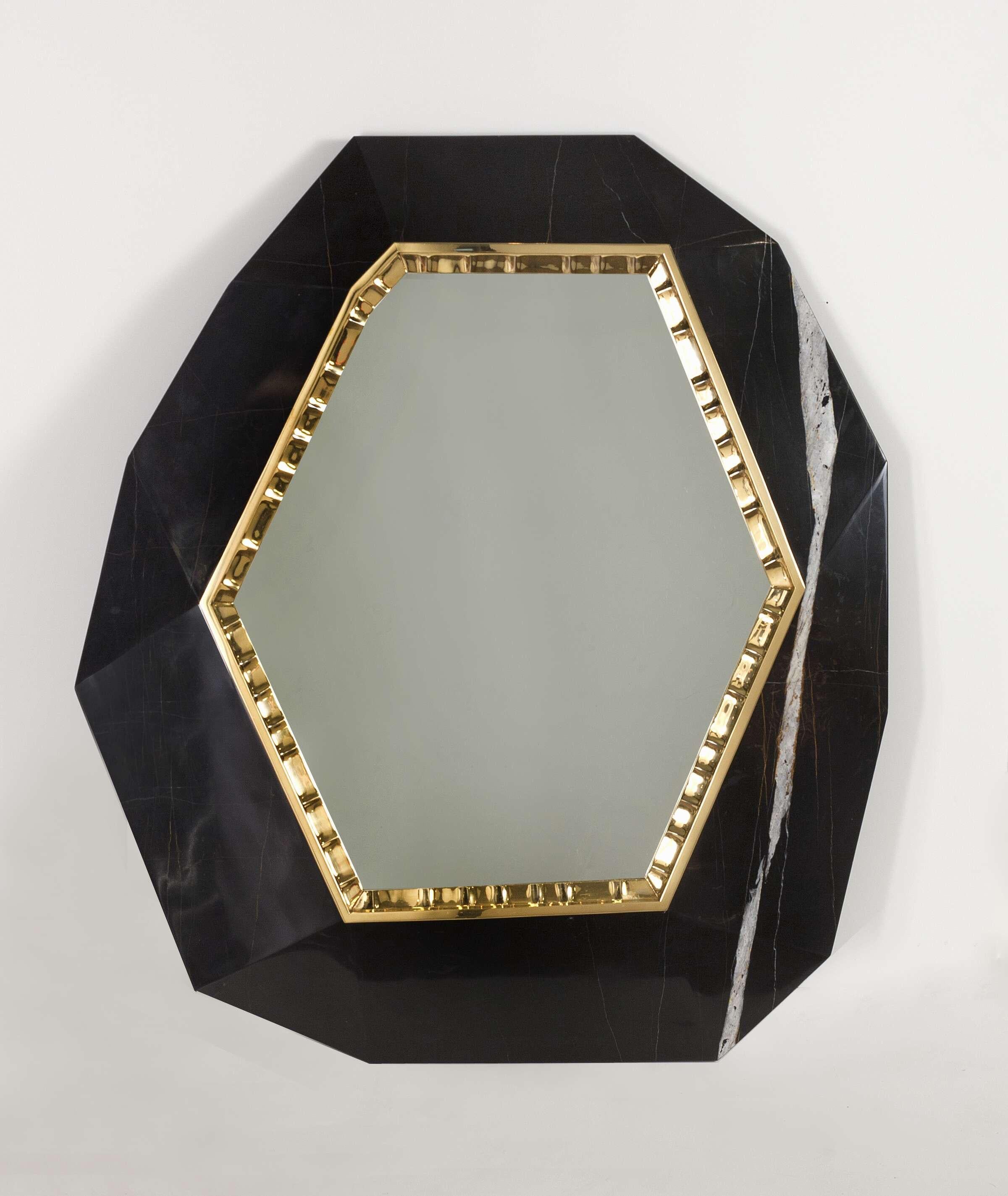 Lucy is a hexagonal mirror set, like a jewel, in a facetted plaque (either of noir doré marble, brown Emperador marble, or polished Royal Oak), and bordered by thin ornamental patinated bronze trim.

Edition of 20.
Stamped: Achille Salvagni