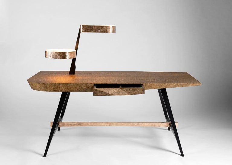 Osaka, Roman designer Achille Salvagni's remarkable desk, is made up of plush materials characteristic of his work – 24-karat gilt bronze, onyx, and lace wood -- and, moreover, possesses his signature aesthetic. With four stabile legs, a