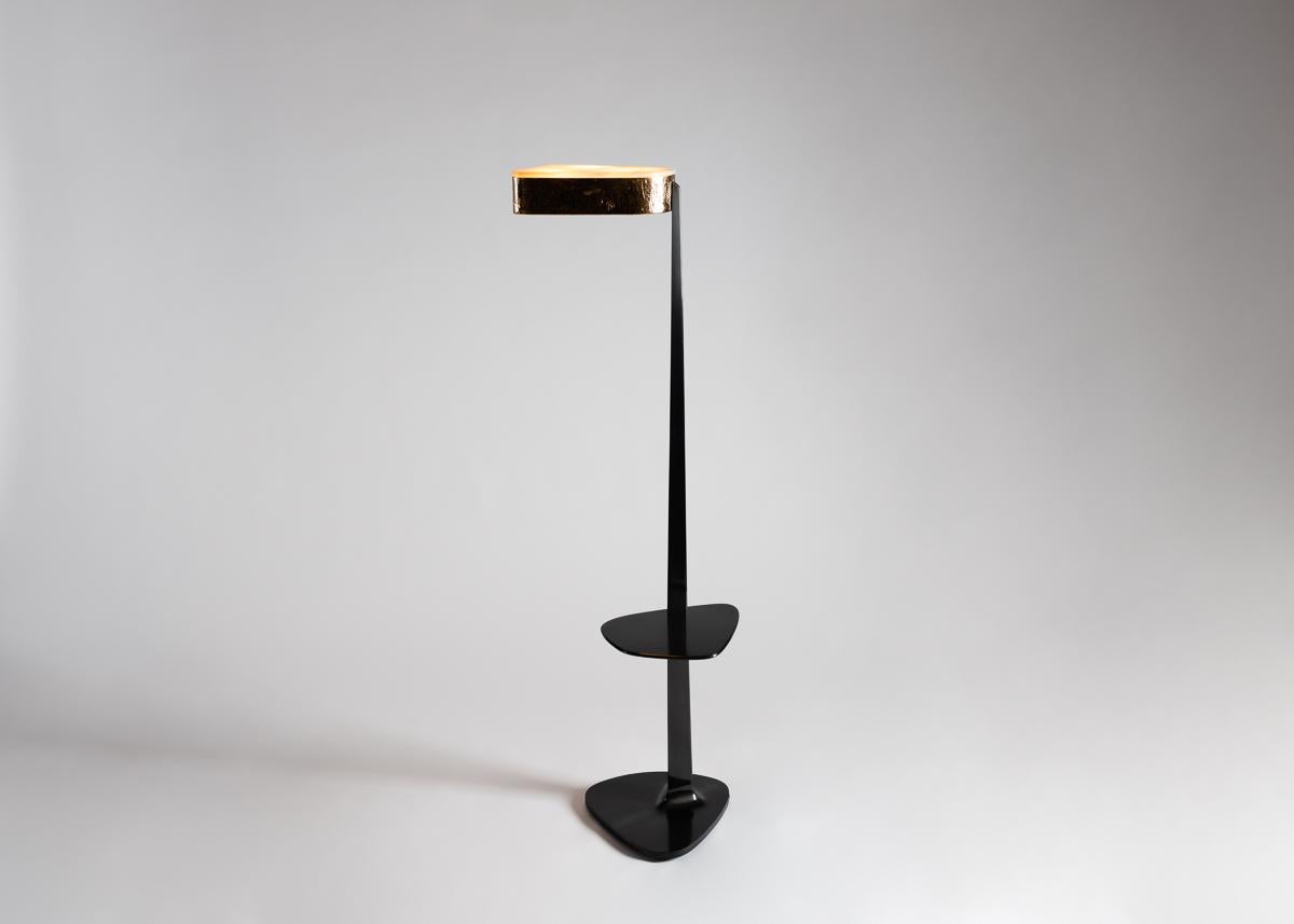 Pinocchio is a floor lamp cut from the same mold as Achille Salvagni’s popular spider chandelier. The piece has a sheer, patinated bronze body, a hand hammered bronze head, and a shade of lush and creamy (though uniquely veined) onyx.