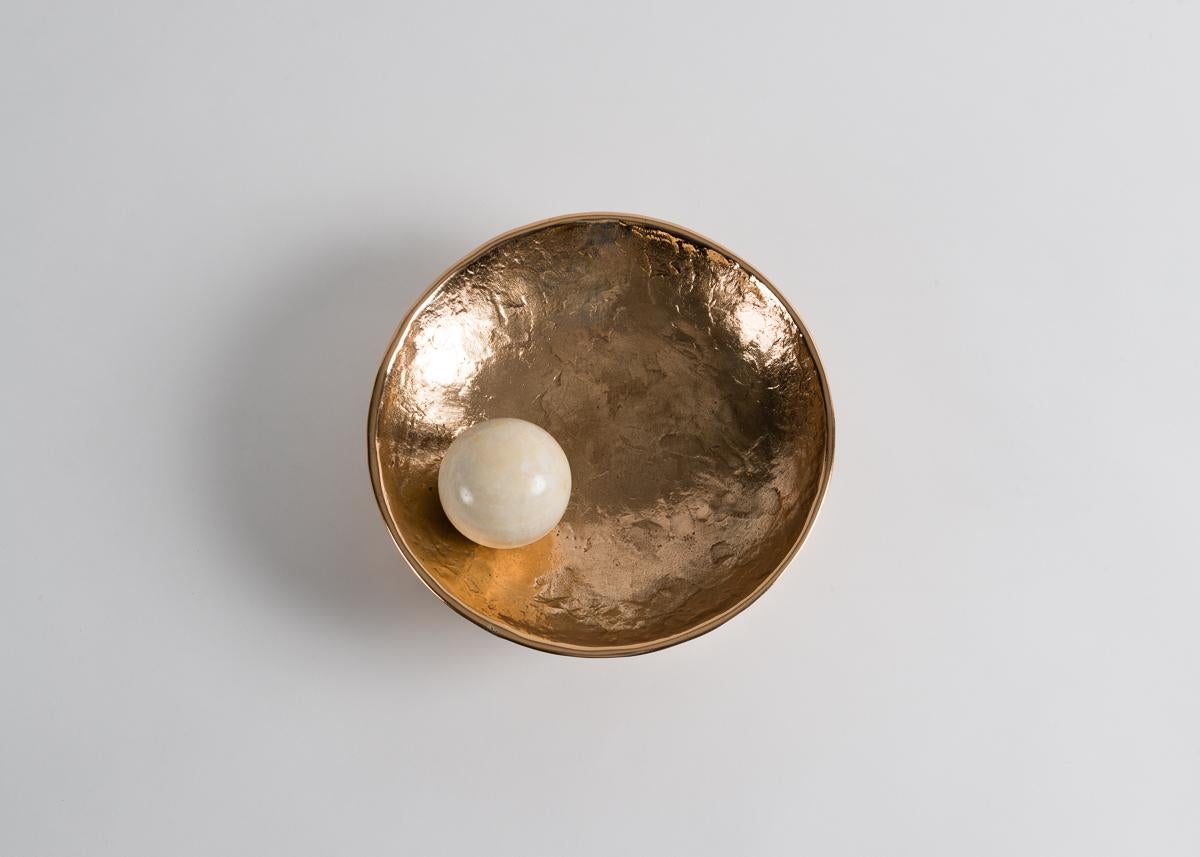 Saturn, Achille Salvagni’s cast bronze concave sconce, is illuminated from within by a celestial onyx sphere reminiscent of a satellite in orbit.

Bulb 20W T3 halogen clear G4 Bi-pin bulb 12V