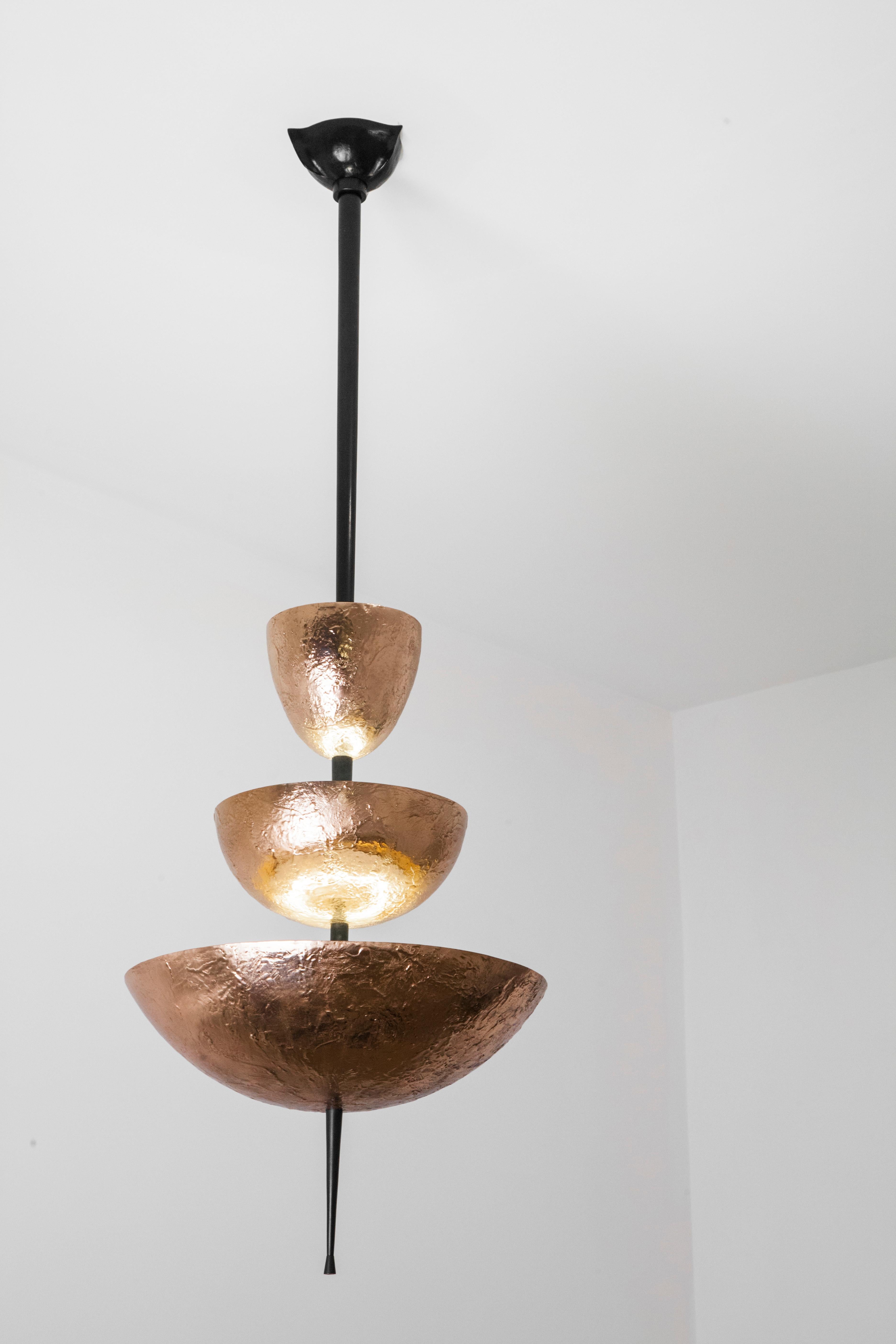 Achille Salvagni
Simposio chandelier
2017
Cast bronze chandelier with a natural finish and burnished bronze stem. This chandelier is named after Plato's Symposium, a praise to Eros, God of Love and Desire, and its unique texture is inspired by an