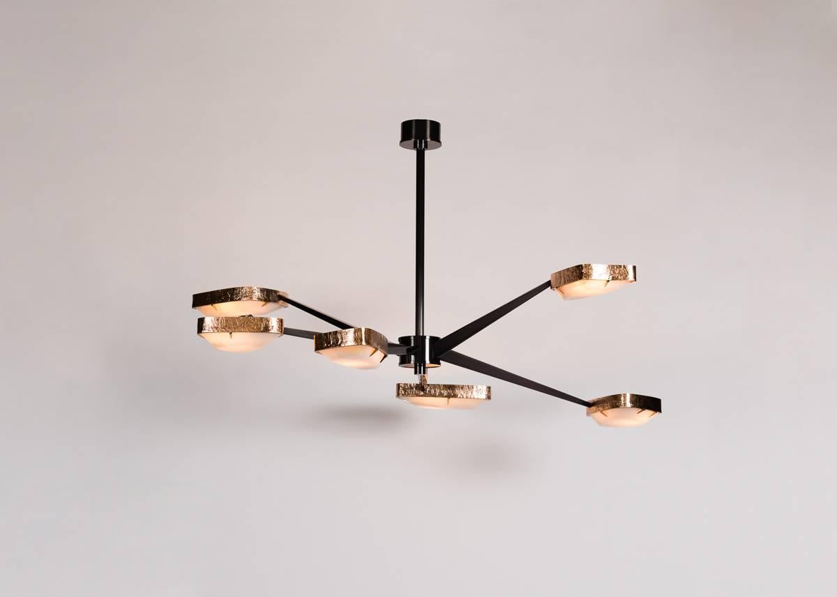 Spider’s six gunmetal patinated bronze arms, accented at their ends with shades of polished bronze and onyx, reach out and over one another, creating an unmatched visual dynamism and bathing all below in a warm, soft light.

Overall drop: 39
Bulb: