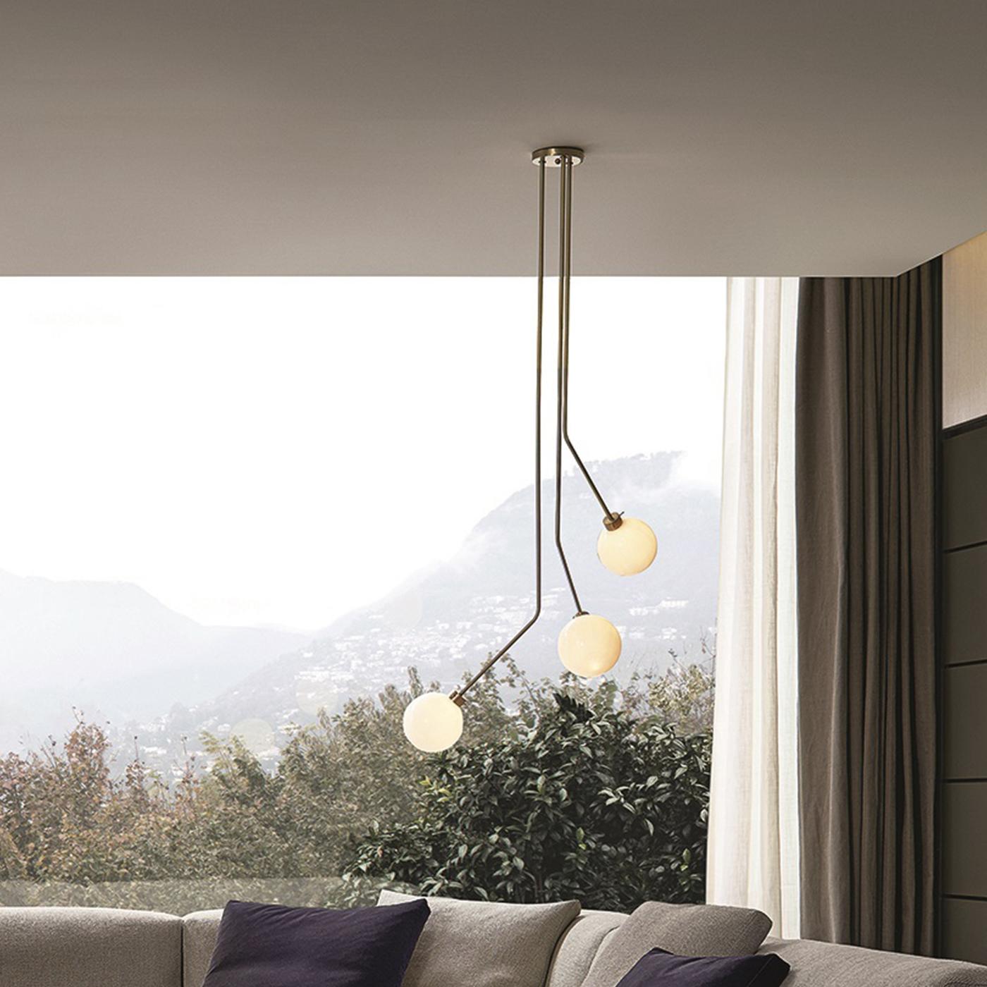 Evoking the charm and elegance of mid-century decor, this ceiling lamp combines traditional materials with a clean silhouette, creating a timeless piece for any home. Both a striking sculptural piece and a functional object, this lamp features a