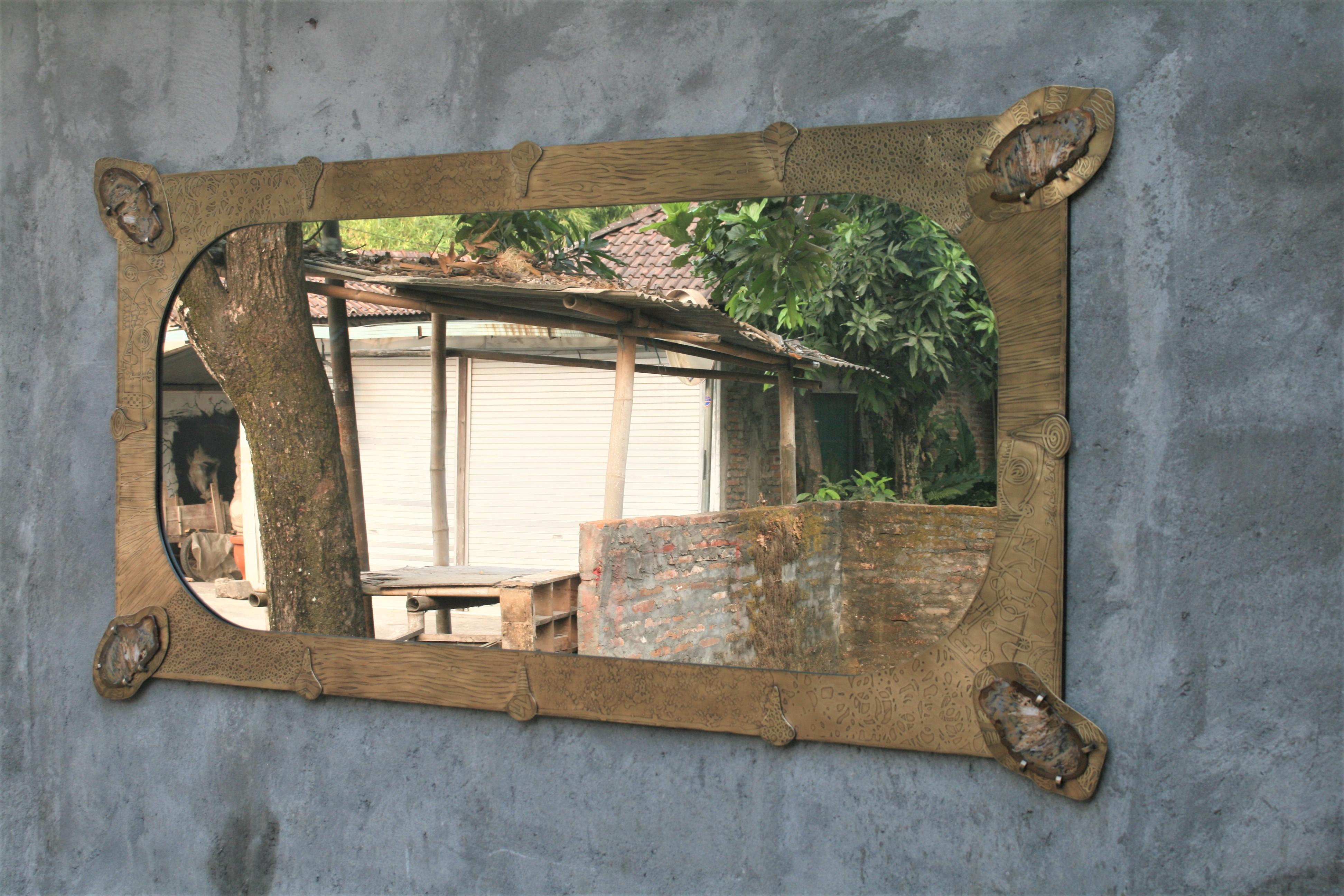Unique wall mirror by Studio Belgali, handmade acid etched brass - black patinated, bejeweled with agate stone slices that come from the same mineral. Can be hang horizontally and vertically. 

Stunning piece of art by Studio Belgali. Custom made