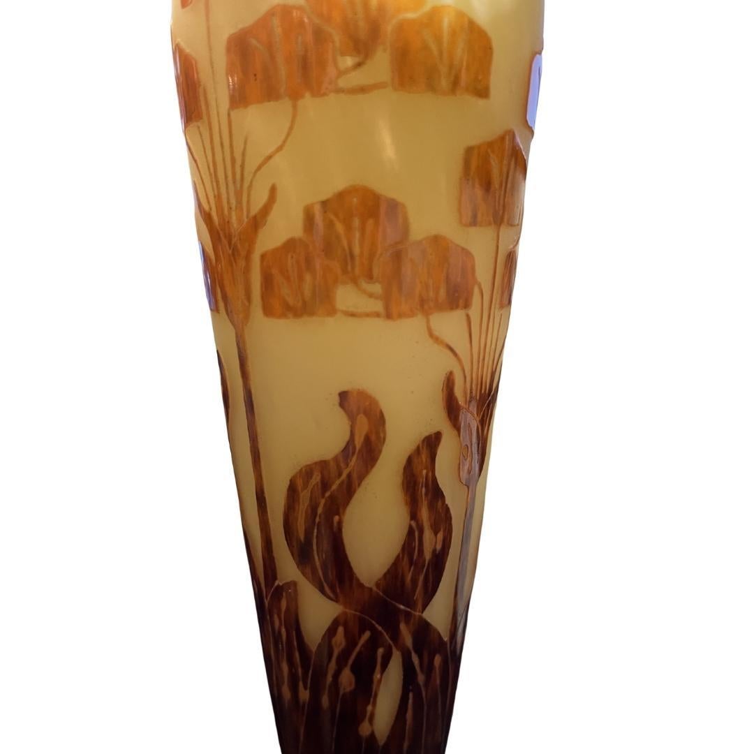 Vase Amourettes design
Acid Etched Cameo Glass Vase by Le Verre Francais (Ch. Schneider factory 1918-1933)
Of tapering cylindrical form, with a knopped stem and puffed foot, in mottled amber and orange glass cased in plum-colored glass decorated