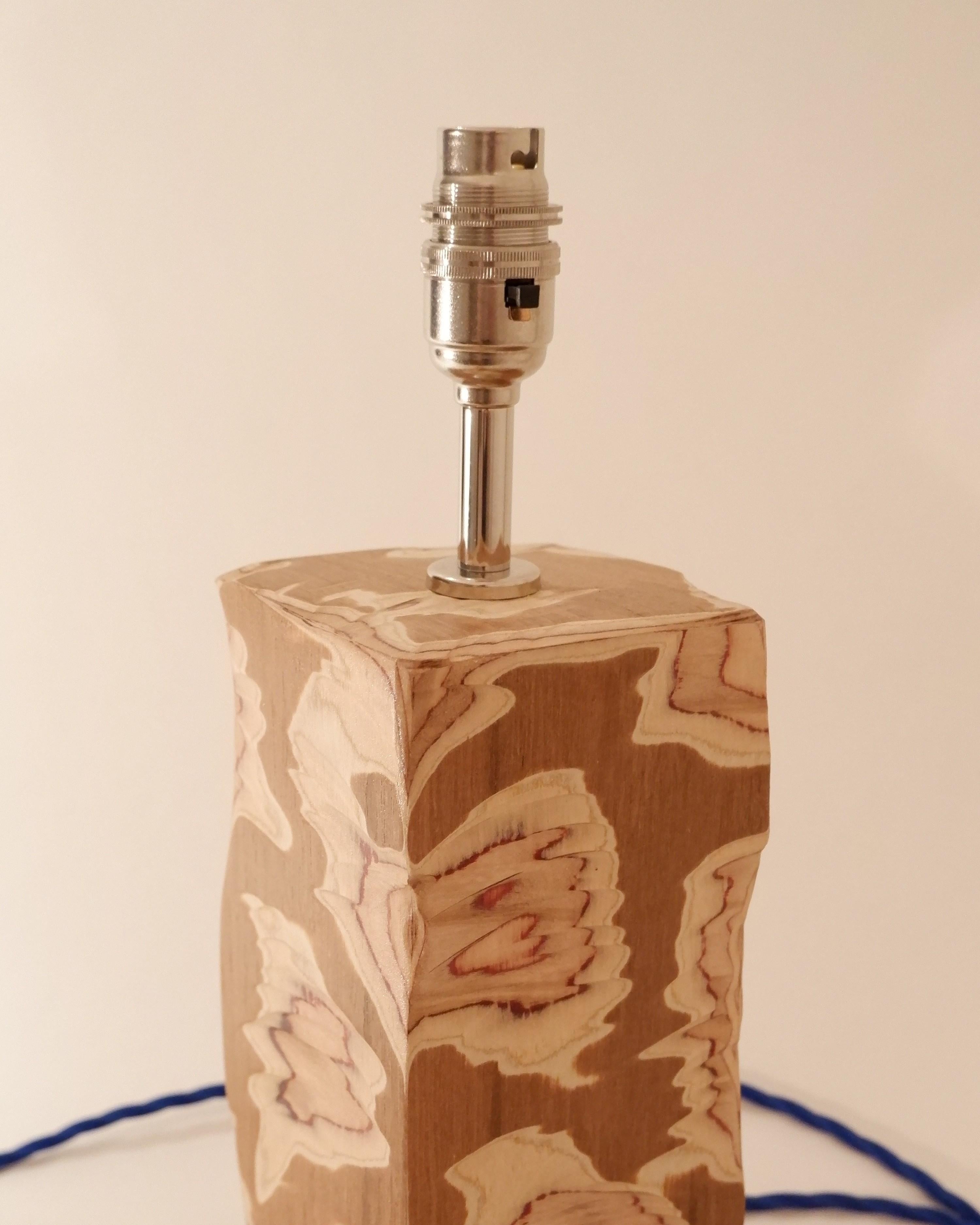 Acid Table lamp with Nickel lampholder and electric blue twist cable. Paired with our very own Poplin lampshade with electric blue zig zig stitching. 

The lamp base is constructed from Teak veneered Birch plywood which has been carved away to