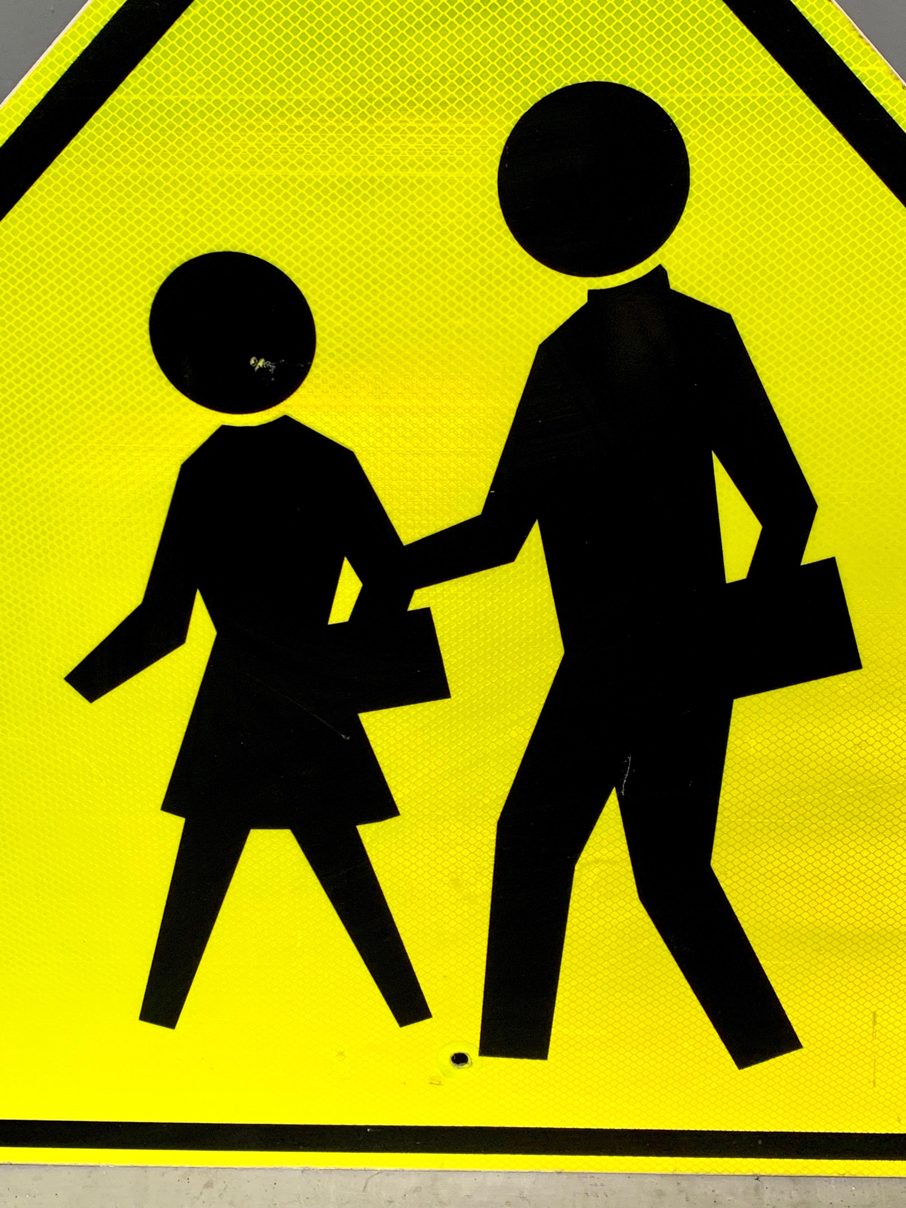 Great acid yellow reflective road sign from the City of Los Angeles. Depicting a man and woman crossing the road. Good vintage condition.

 