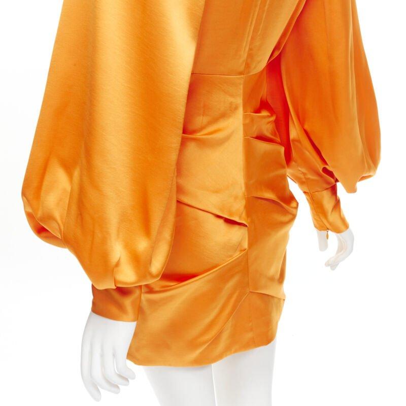 ACLER bright orange silky keyhole draped raglan puff sleeves mini dress US2 XS
Reference: AAWC/A00418
Brand: Acler
Material: Polyester
Color: Orange
Pattern: Solid
Closure: Zip
Lining:  Fabric
Extra Details: Back zip and ruched bottom details.
Made