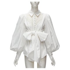 ACLER camicetta con maniche a sbuffo in cotone bianco con ritaglio di occhielli e grande fiocco US2 S. White