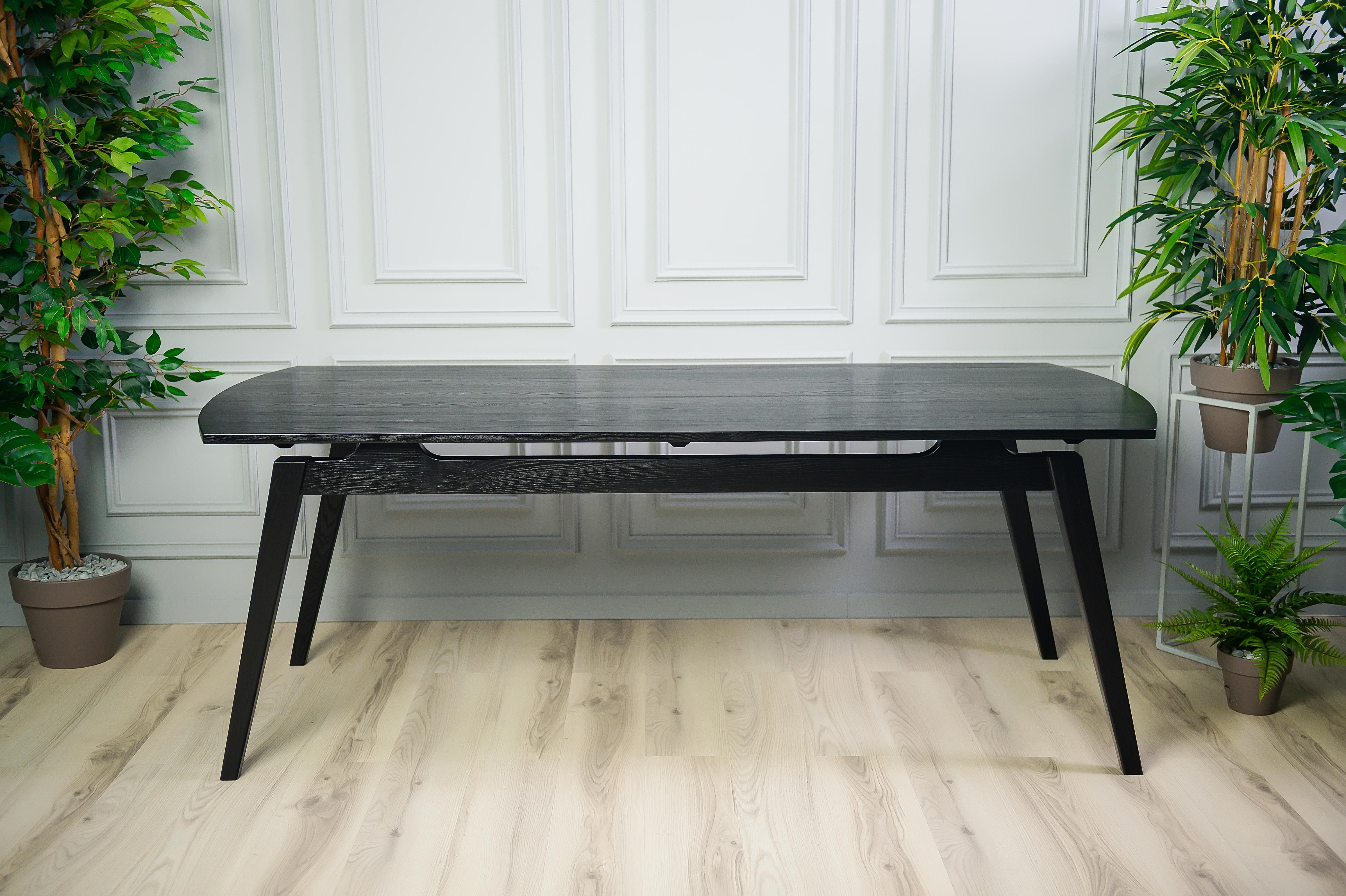 The Acline Dining Table offers a unique presentation that delivers a spacious yet elegant dining experience. The angle and trim of this table allow for a Mid-Century Modern expression that can fit into any home. With plenty of options for seating,